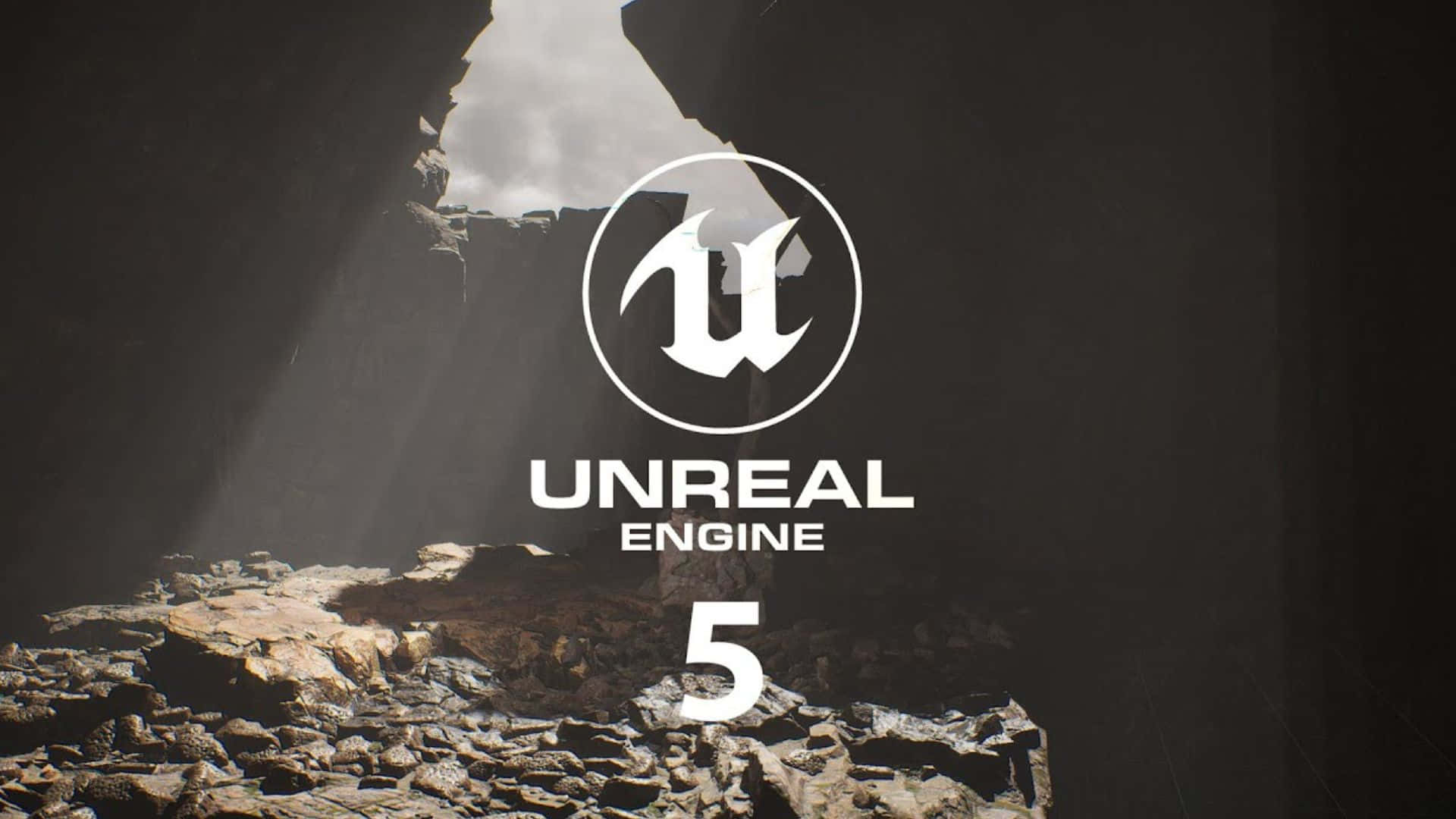  壁紙 — Unreal Engine 5 標誌在岩石洞穴中閃耀，上方狹窄開口透出戲劇性的光線。