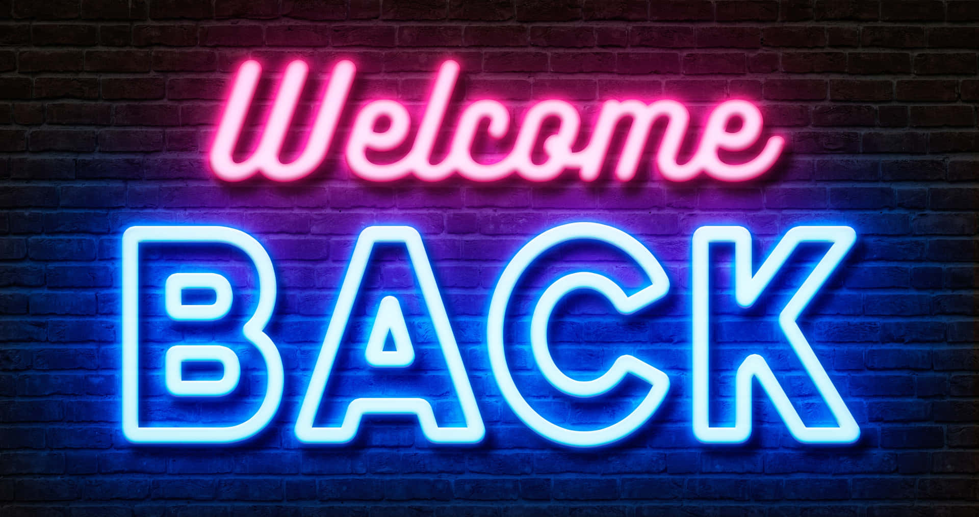  壁紙 — 鮮豔的粉紅色和藍色霓虹燈牌寫著「Welcome BACK」，在深色磚牆上發光。
