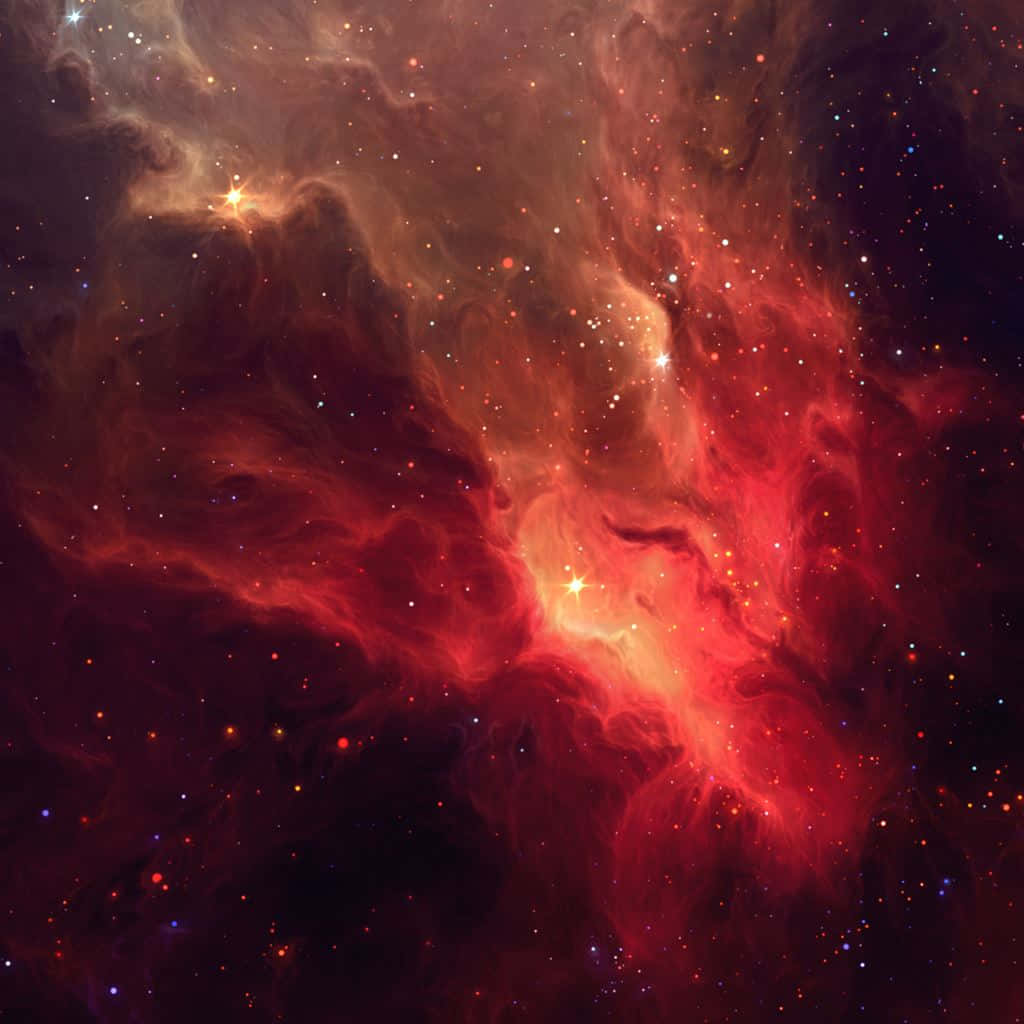 在深空中，一個火紅和橙色的星雲與星星一起發光。