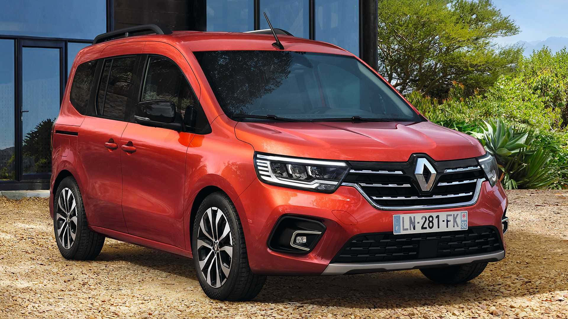 Renault Kangoo 桌布 壁紙 — 一輛鮮紅色的雷諾Kangoo客貨車停在碎石上，前方是現代玻璃建築，周圍綠意盎然。