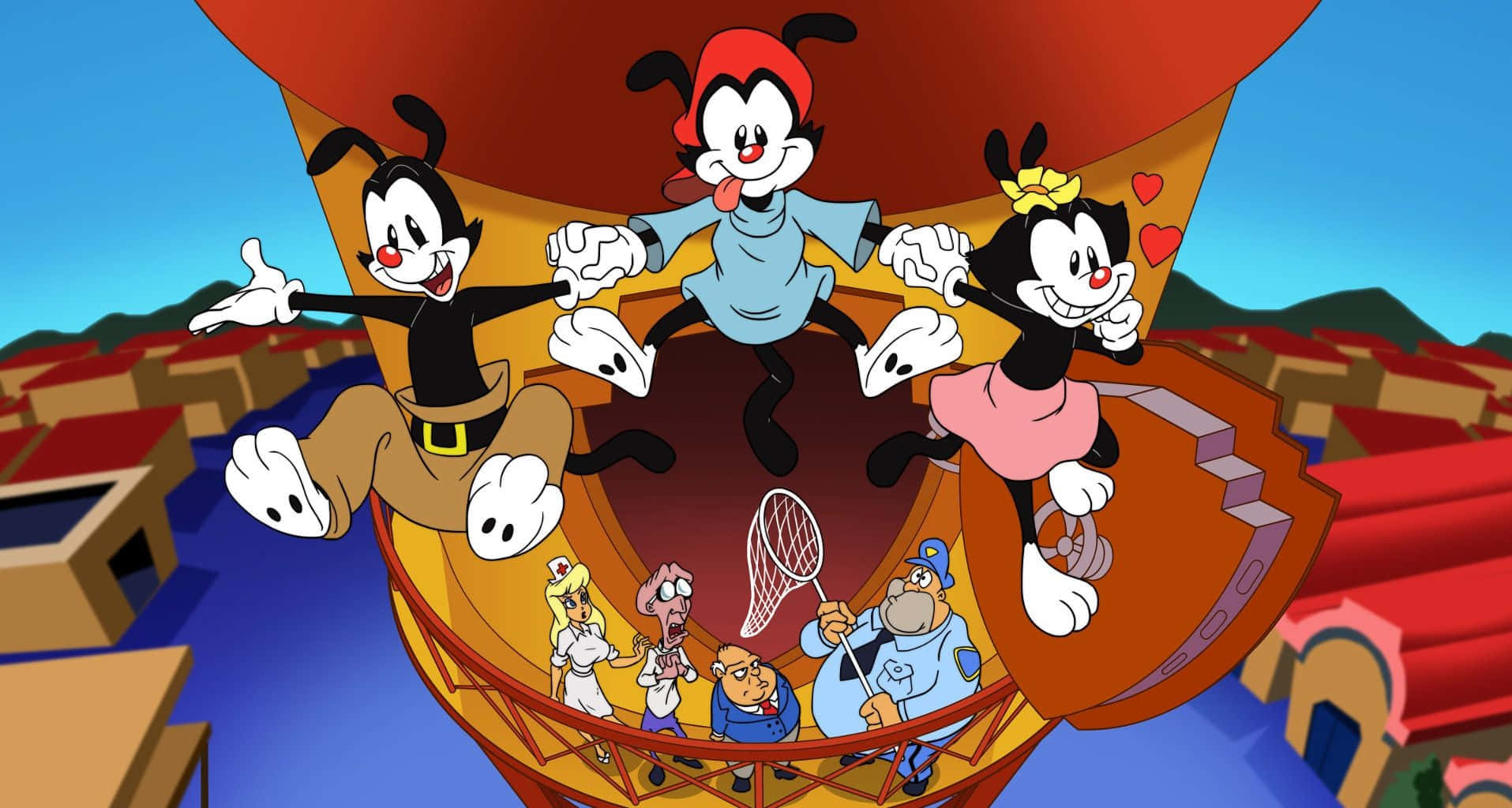 「Wakko、Yakko 和 Dot 在 Animaniacs 中歌唱！」 壁紙 — 三個卡通角色快樂地掛在一個巨大的熱氣球上，飛越色彩繽紛的小鎮，下方有較小的角色抬頭觀看。