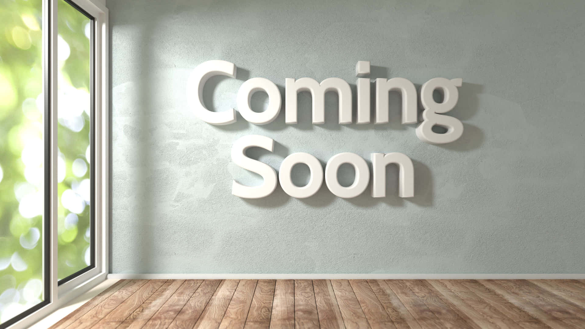 白色3D字母在牆上寫着 'Coming Soon'，旁邊是窗戶，窗外有綠色樹葉。
