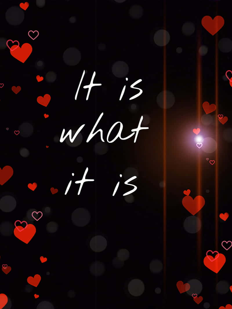  壁紙 — 白色手寫文字在深色背景上寫著「It is what it is」，周圍有漂浮的紅色心形和發光的燈光條紋。