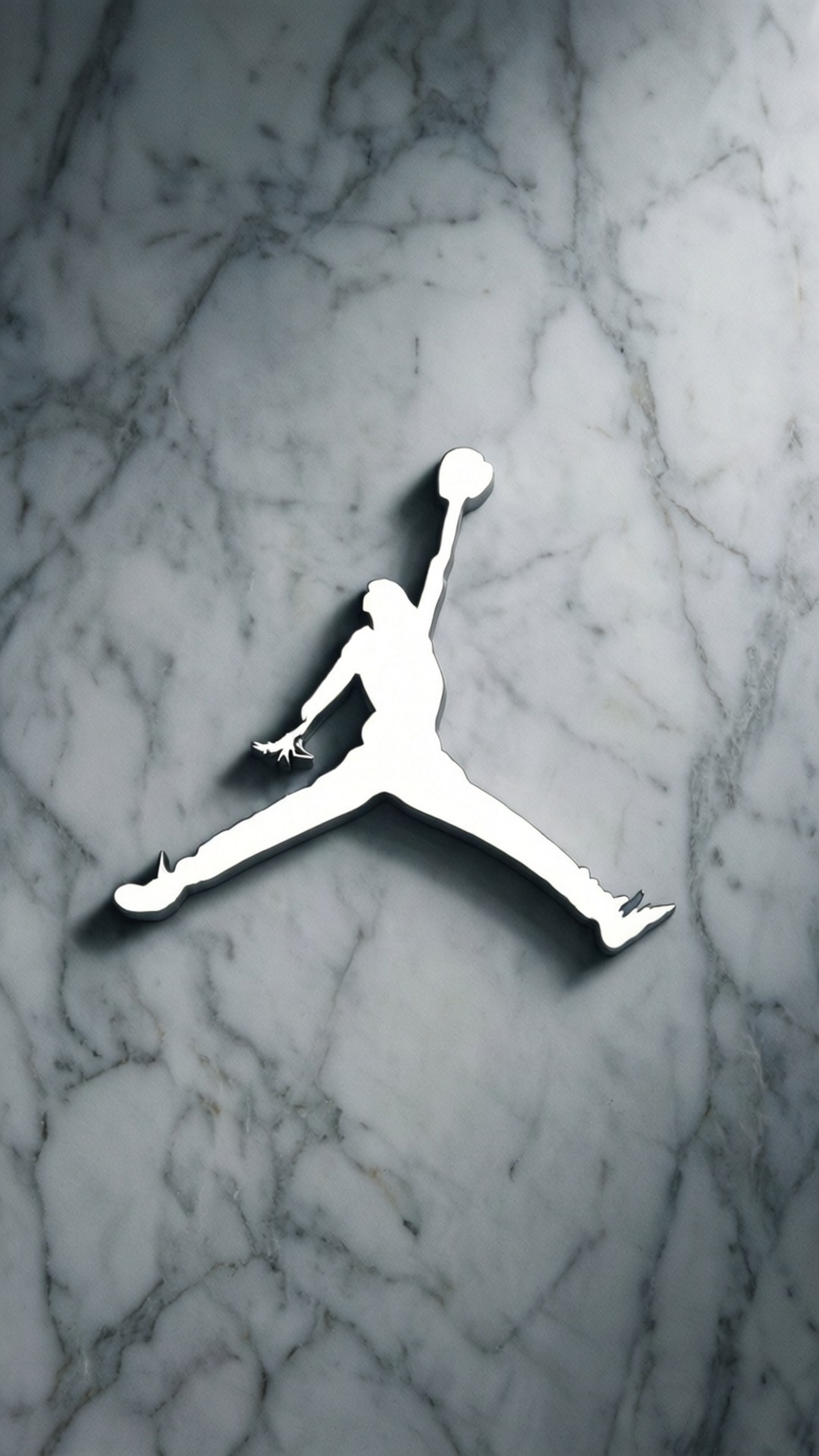 White Marble Jumpman 壁紙 — 標誌性Jordan標誌的白色剪影在拋光灰色和白色大理石背景上動態跳躍。
