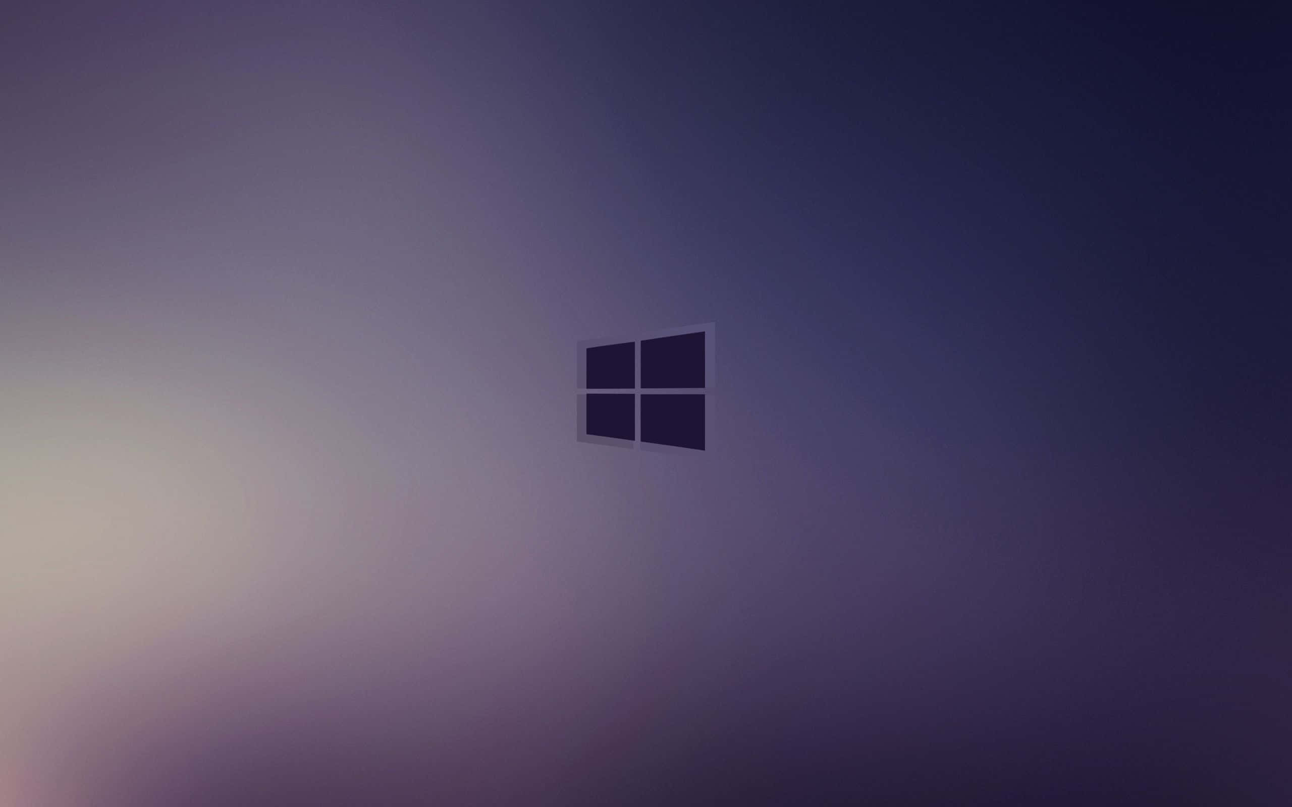 暗藍 Windows 1 壁紙 — 一個極簡的Windows標誌居中於漸變紫色背景上，帶有柔和的光暈。