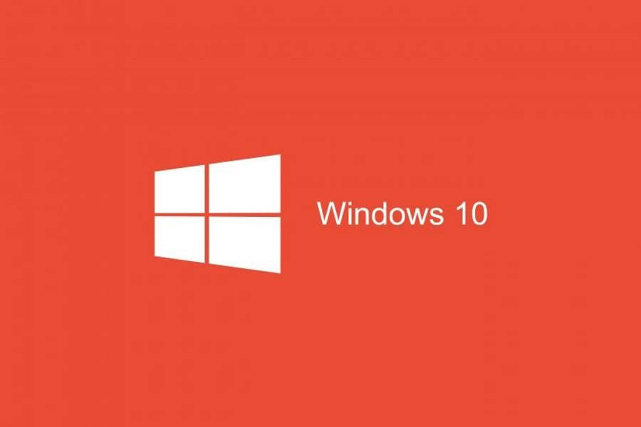 紅橙色Windows 10封面 壁紙 — 一個乾淨簡約的紅色背景，白色Windows 10標誌和文字突出地居中顯示。