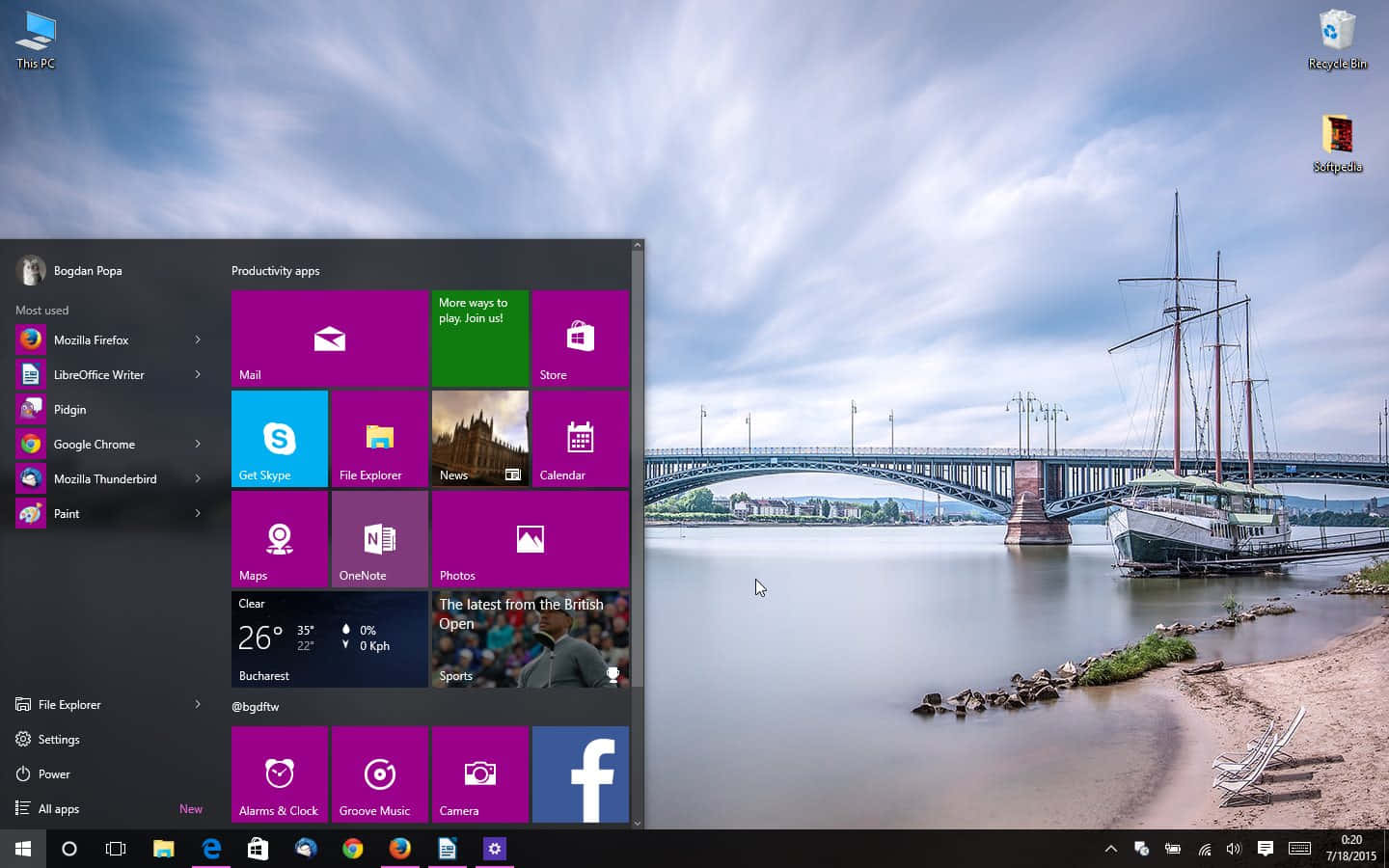 Windows 10 開始功能表在河景場景中，有橋樑和歷史船隻。