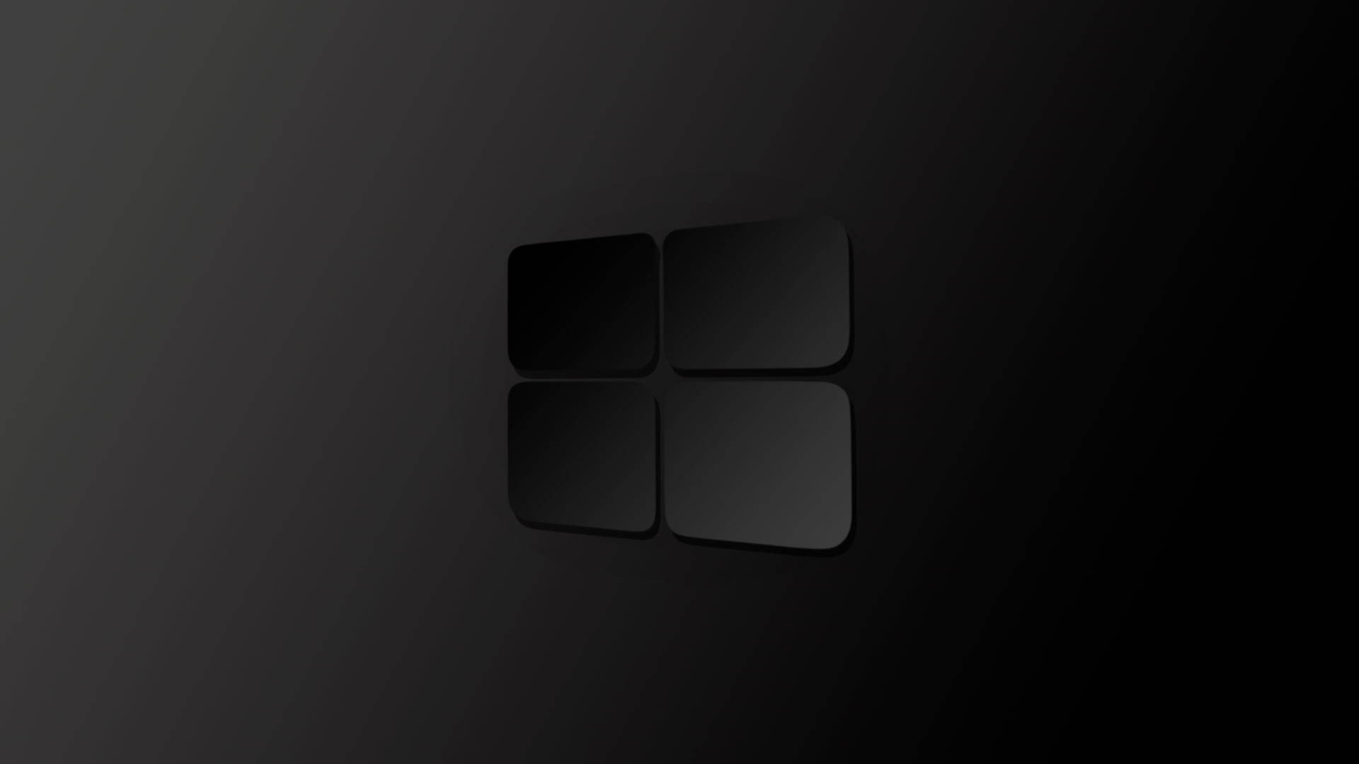 黑色 Windows 10 高清帶陰影 壁紙 — 極簡黑色Microsoft標誌，帶有細微漸變和陰影，置於深色漸變背景上。
