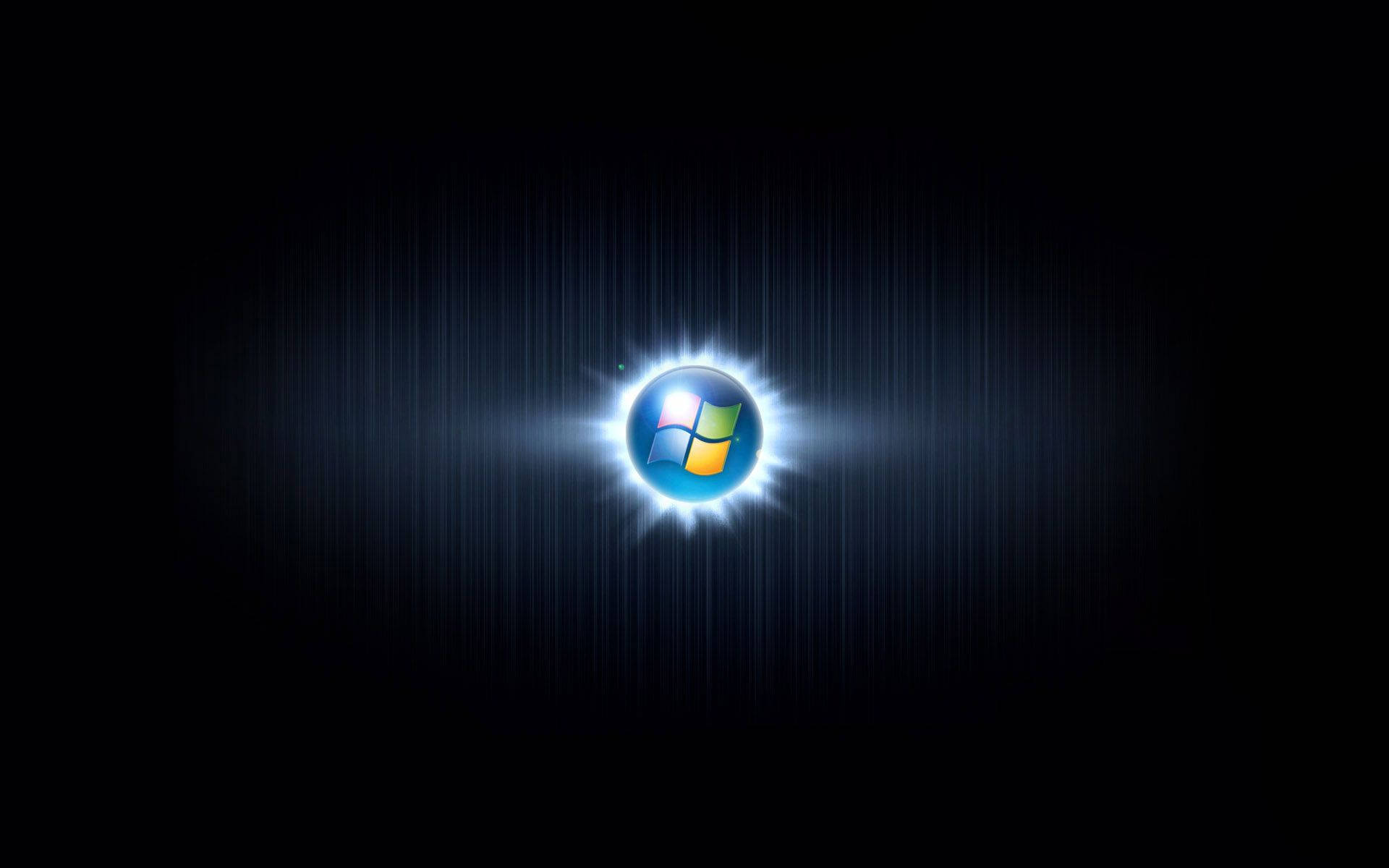 黑暗背景上發光的Windows標誌及光線。