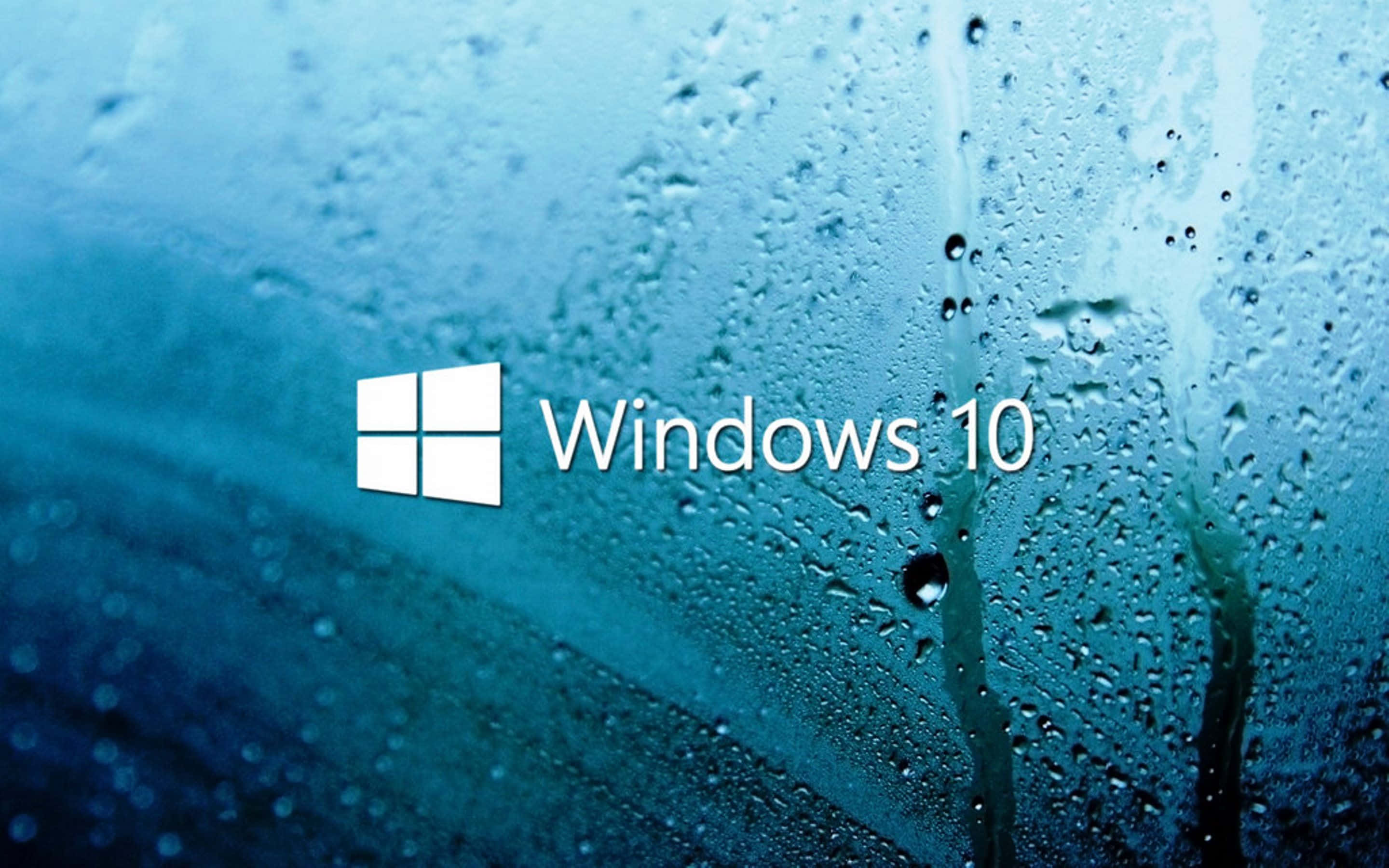 Windows 10 桌面背景 壁紙 — Windows 10 標誌出現在帶有雨滴的藍色窗戶上，水滴順流而下。