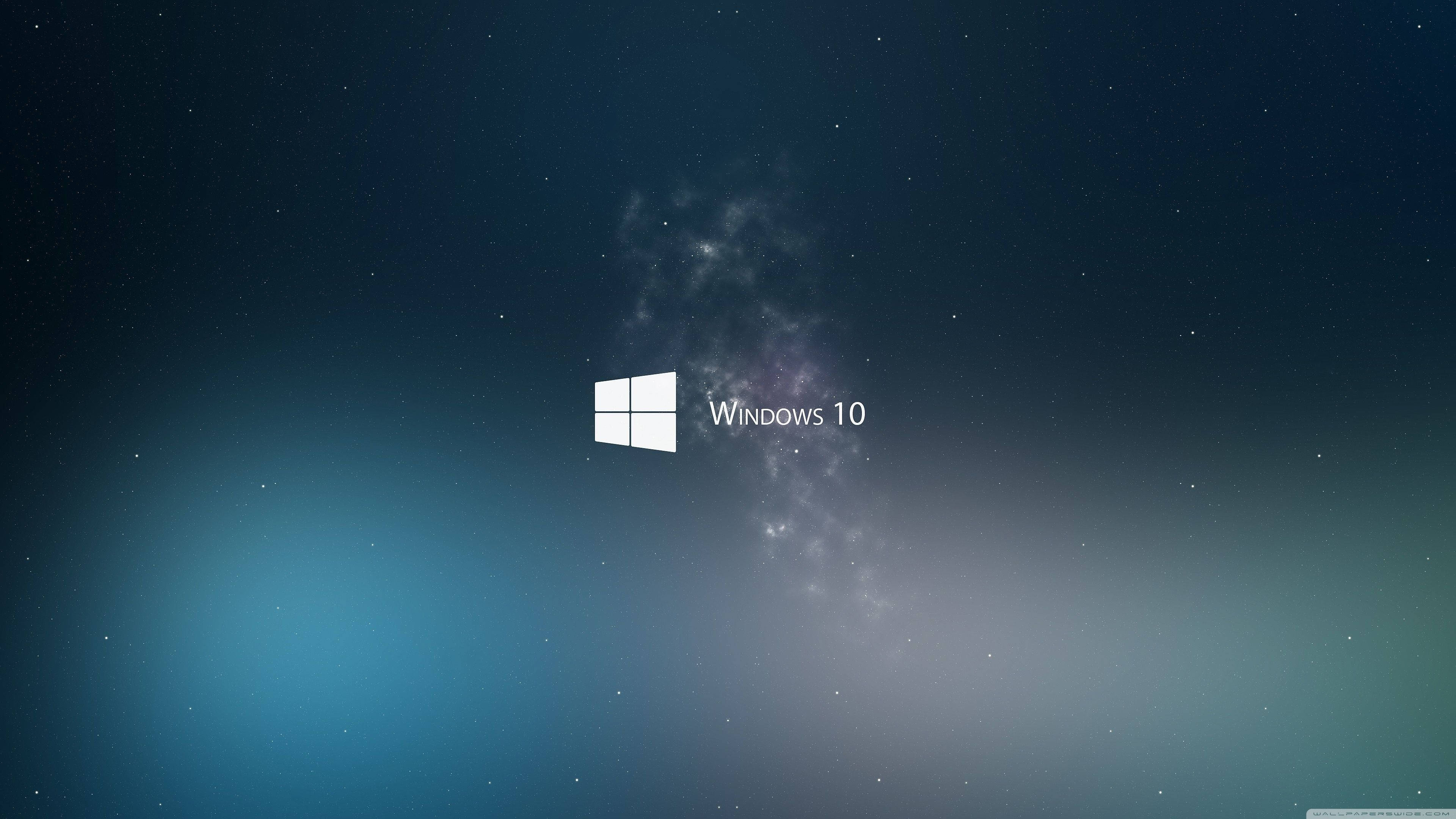 Windows 10 標誌 壁紙 — Windows 10 標誌置中於星空宇宙背景，帶有星雲和漸變藍色。