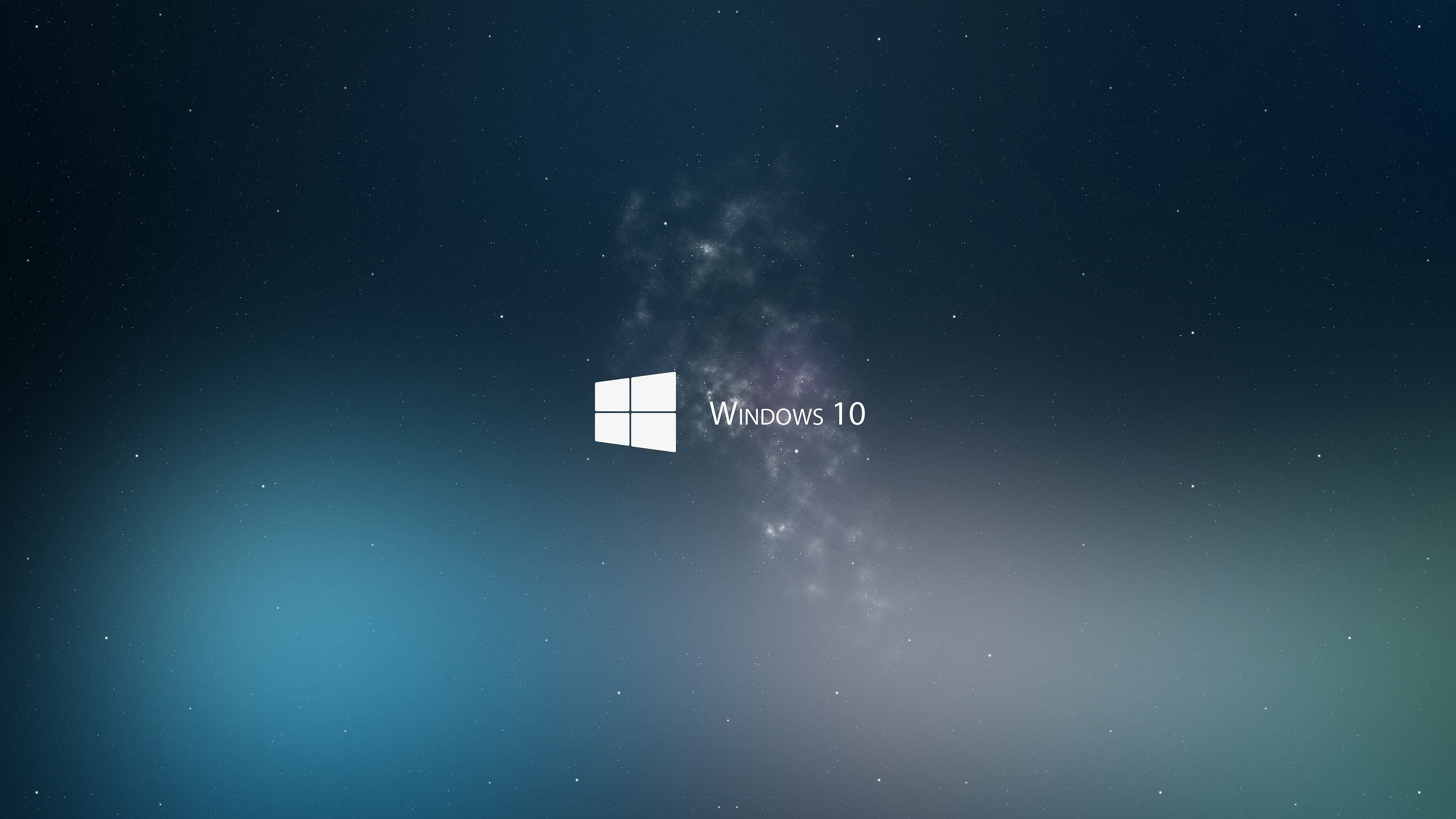 Windows 桌布 壁紙 — Windows 10 標誌居中，背景為星空宇宙，帶有藍色和紫色的漸變。