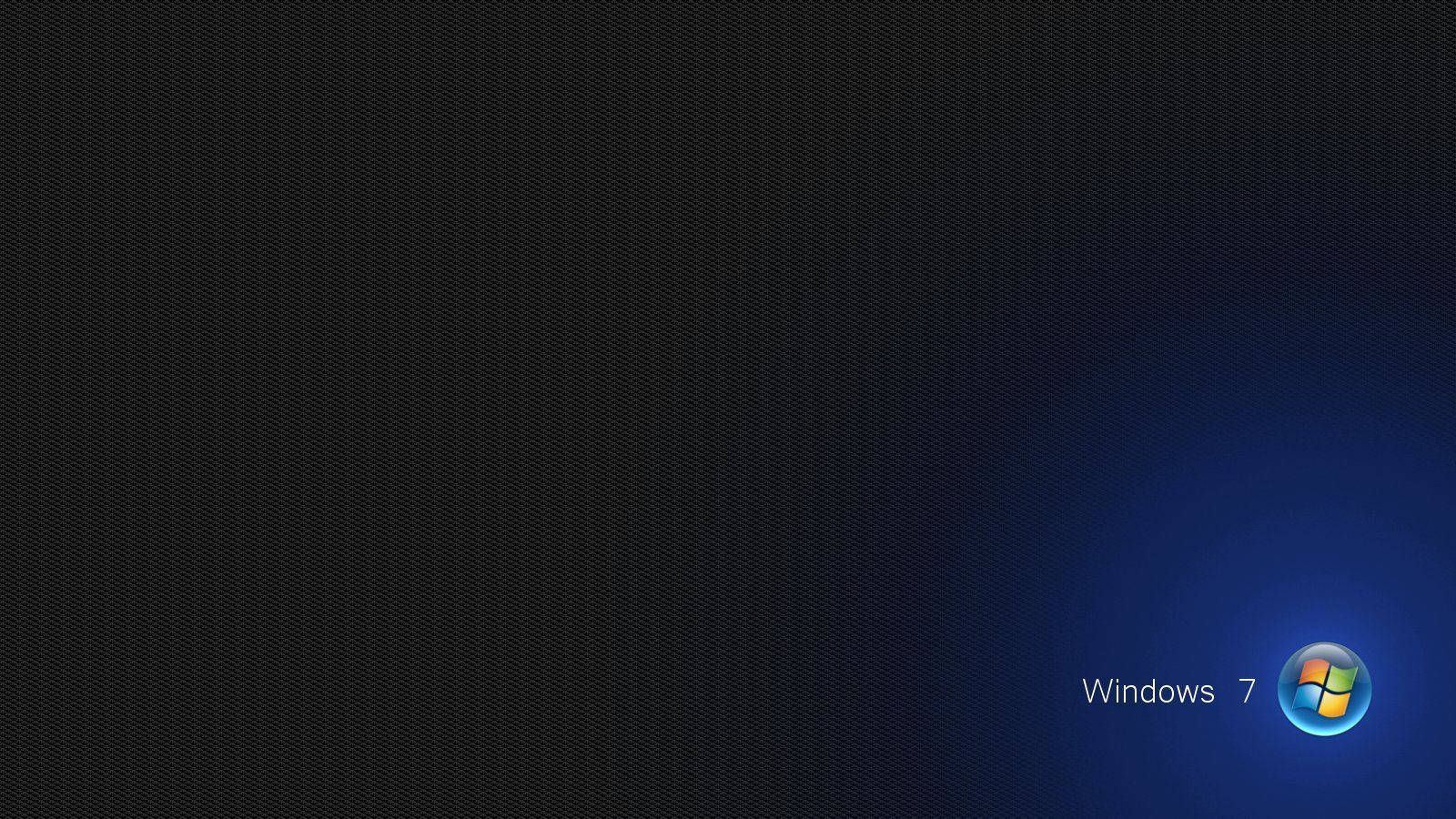 Windows 7 標誌在深色紋理背景上發出藍色光芒