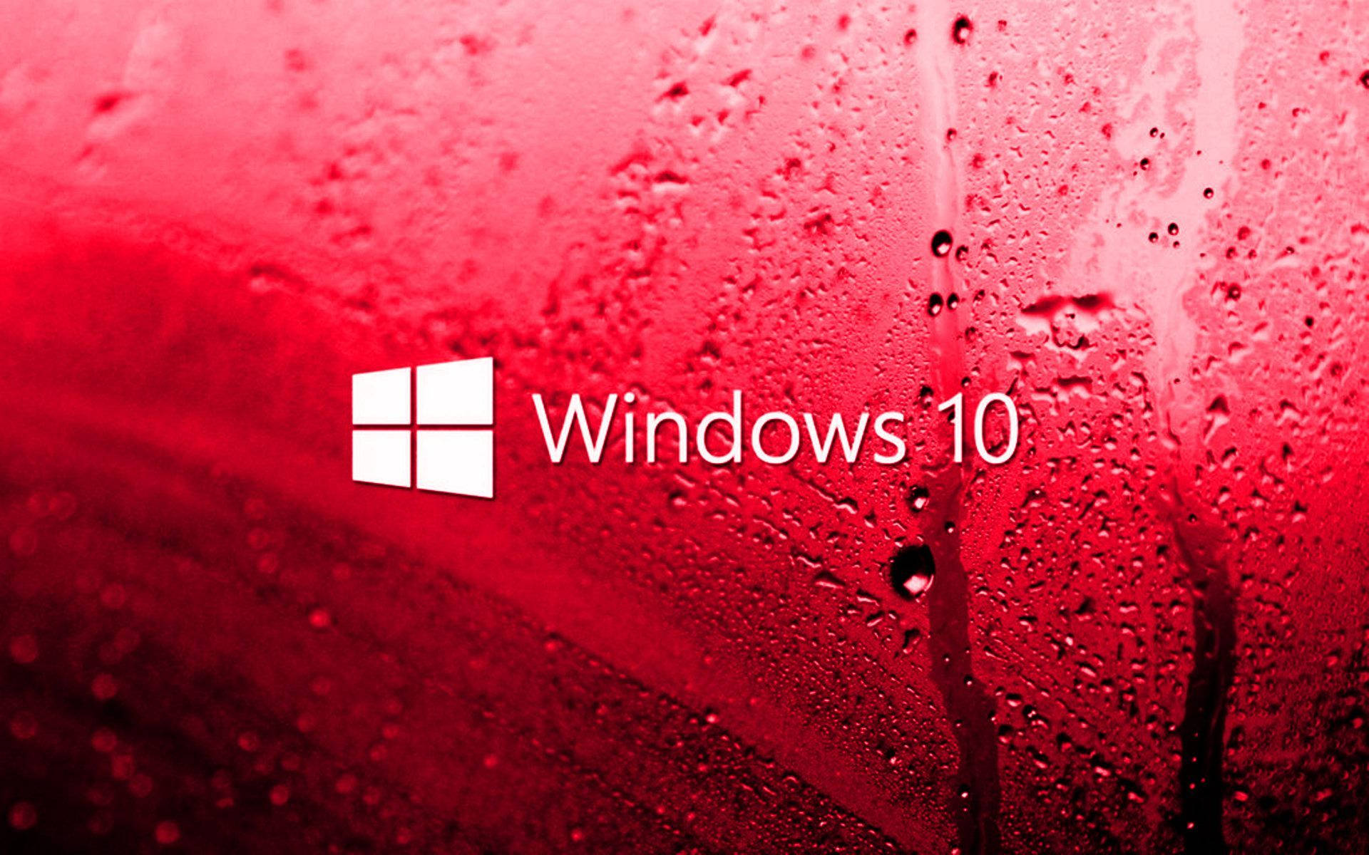 Windows 10 高清紅色玻璃 壁紙 — 白色Windows 10標誌在佈滿水滴的鮮紅色表面上格外突出。