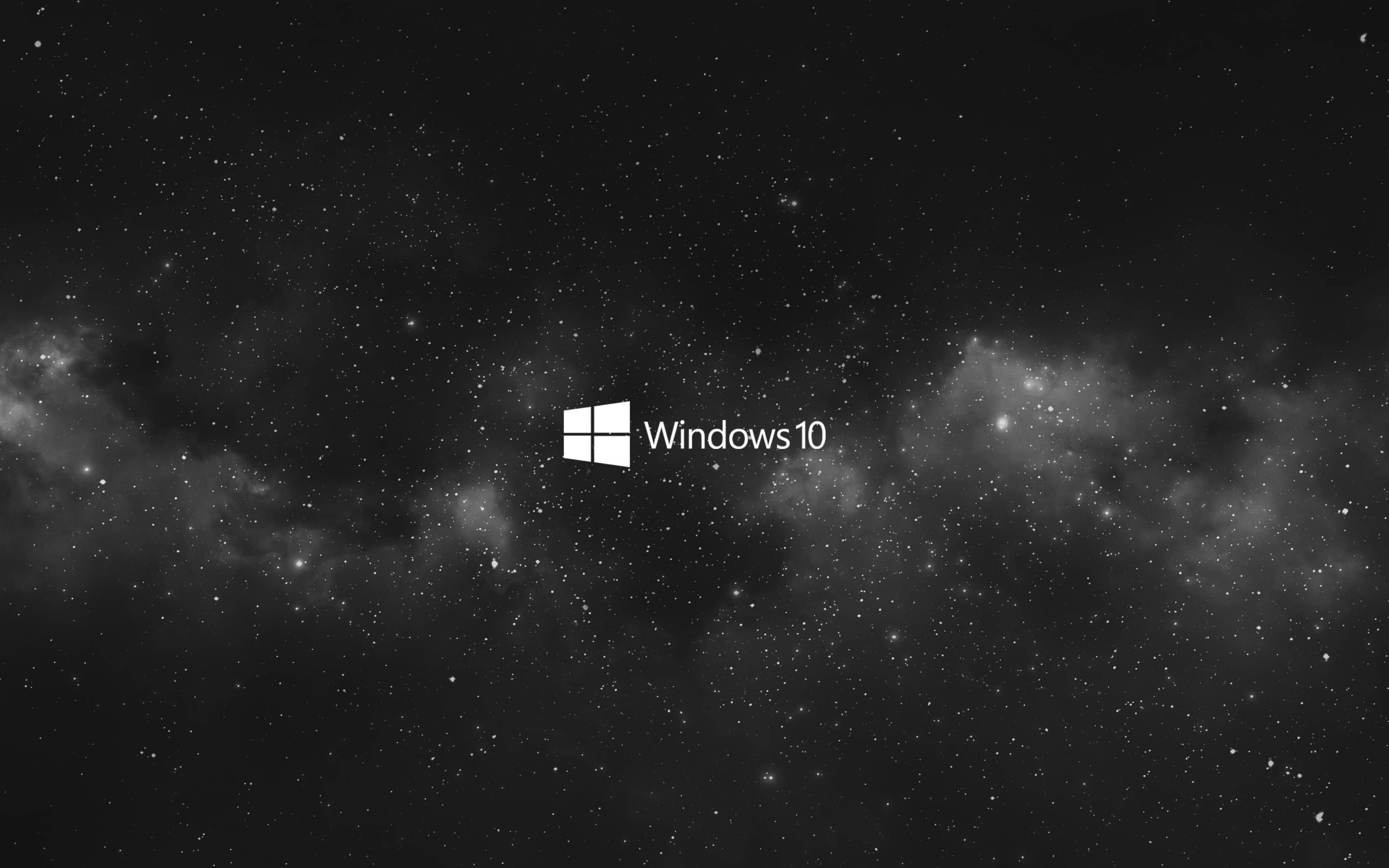 Windows 10 黑色星系 壁紙 — Windows 10 標誌置中於星空宇宙背景，帶有星雲和黑暗太空。