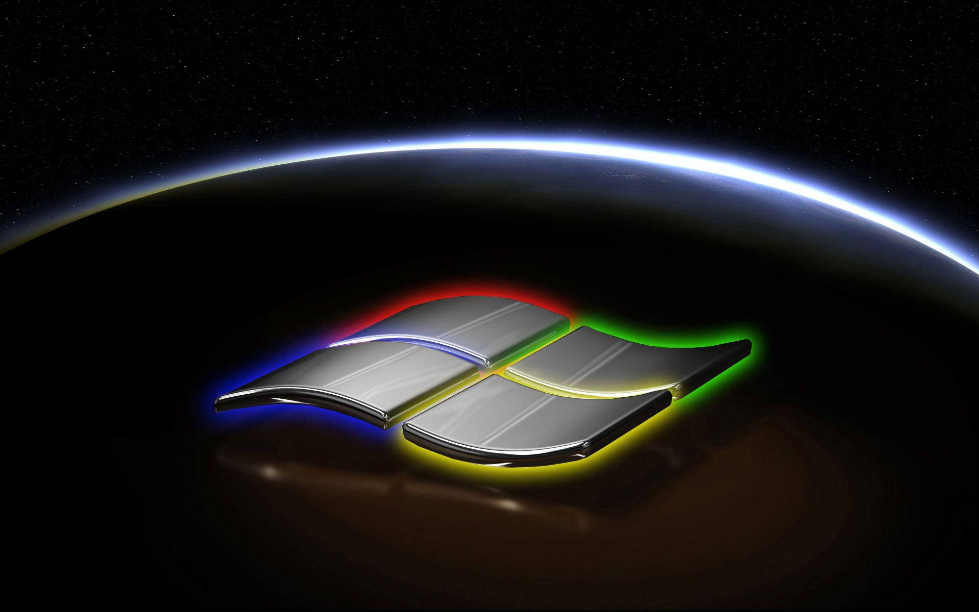 Windows 11 LED黑底 壁紙 — 閃亮的Windows標誌在太空中地球彎曲的地平線上發出彩虹光芒。