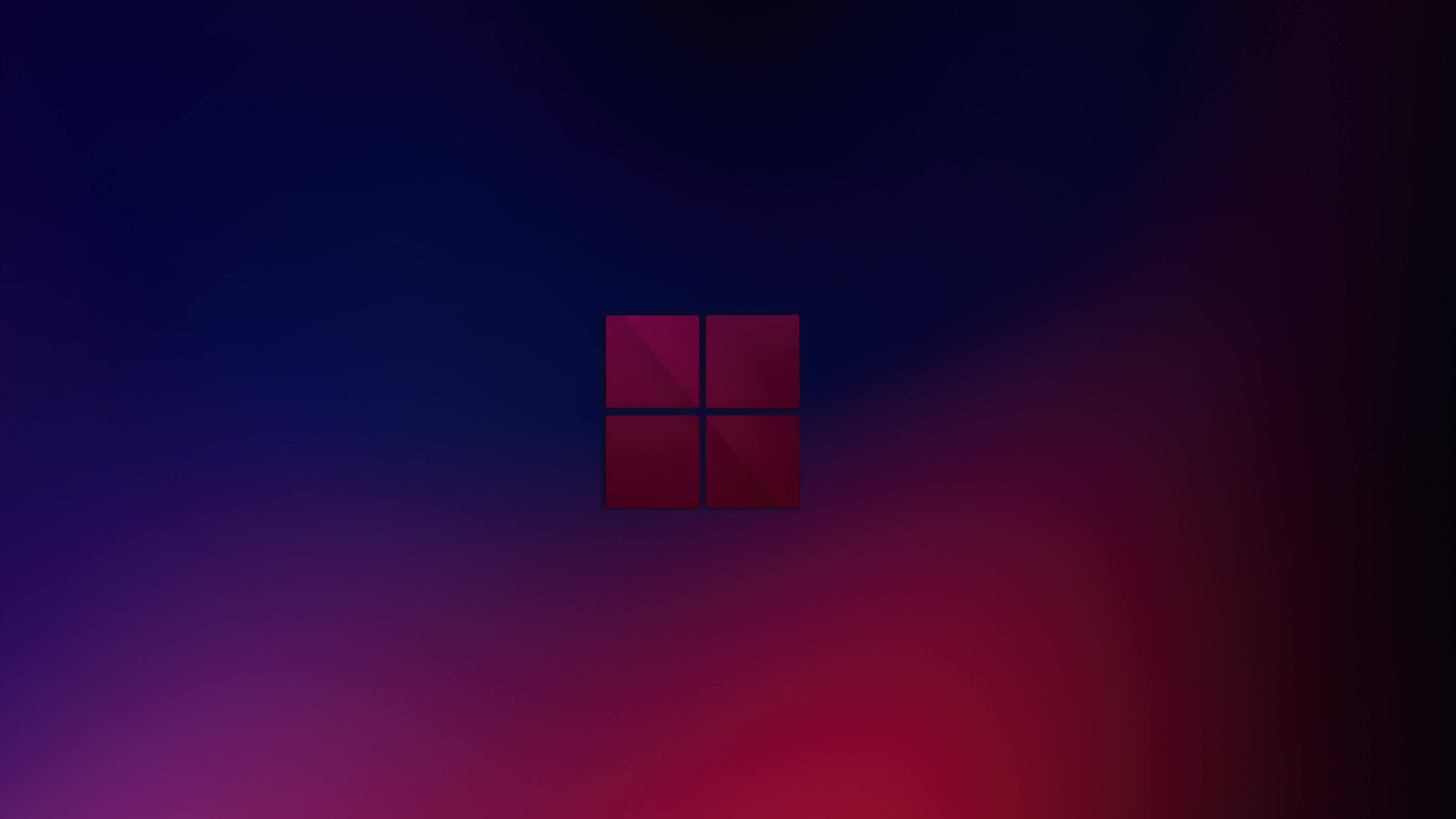 Windows 11 深色模式 壁紙 — 一個發光的紅色Windows標誌，居中於從深藍色漸變到充滿活力的洋紅色的背景上。
