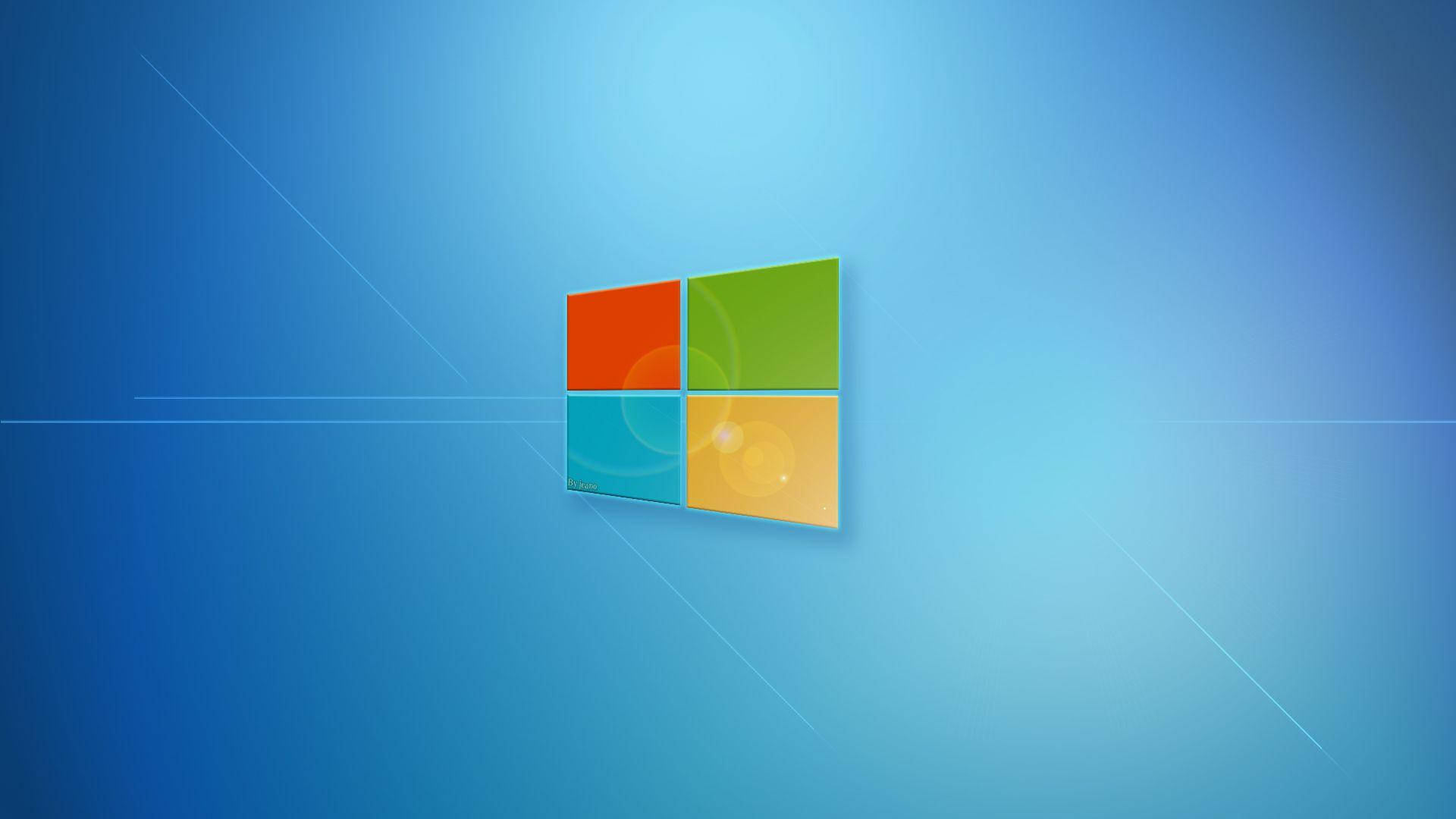 Windows 11經典版 壁紙 — 一個帶有四個彩色方塊的Windows標誌漂浮在帶有微妙光線條紋的漸變藍色背景上。