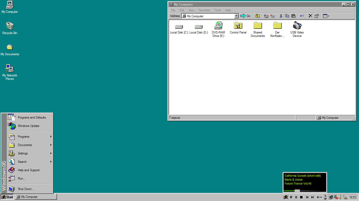 「Windows 95 的力量」 壁紙 — Windows 98 桌面，帶有青綠色背景，顯示我的電腦視窗和開始功能表已開啟。