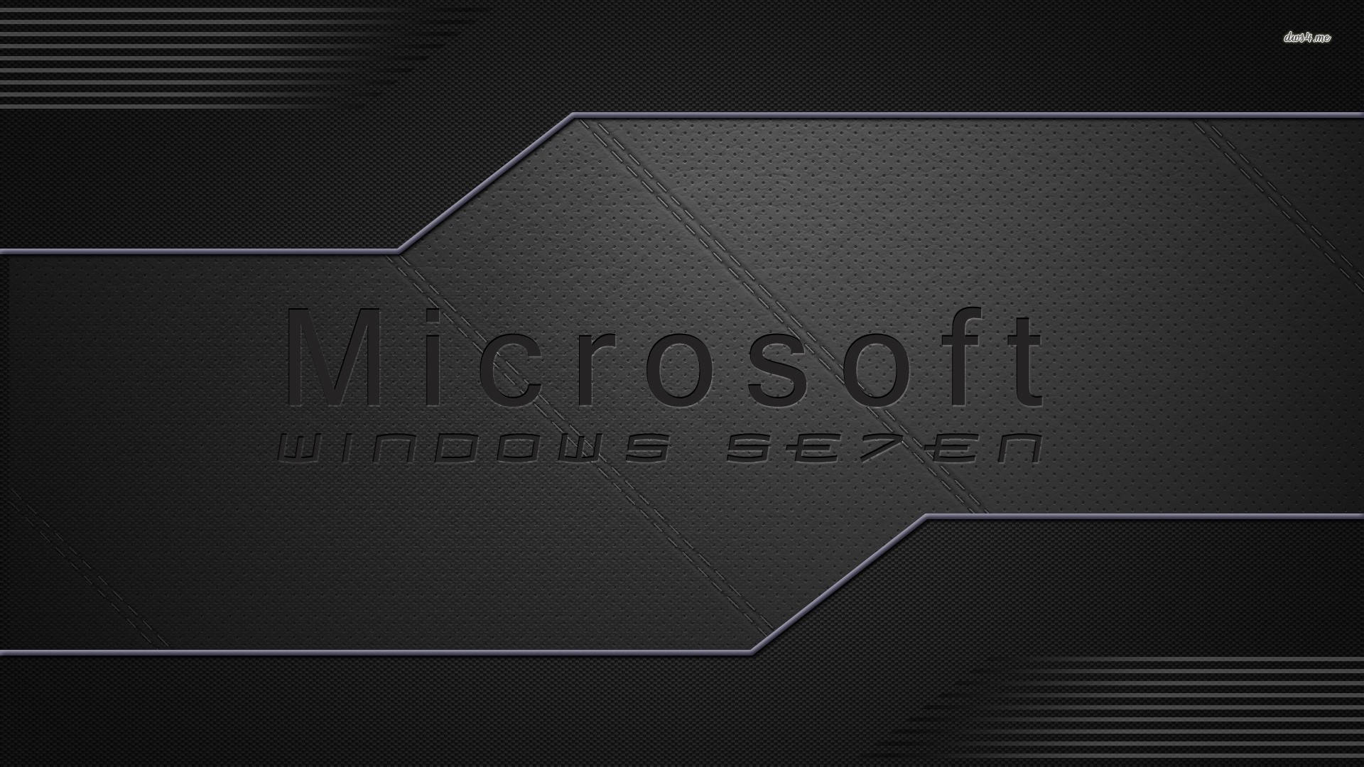 Windows Se7en 黑色桌面壁紙 壁紙 — 一款時尚的黑色紋理牆紙，帶有微妙的浮雕字體Microsoft Windows Seven標誌。