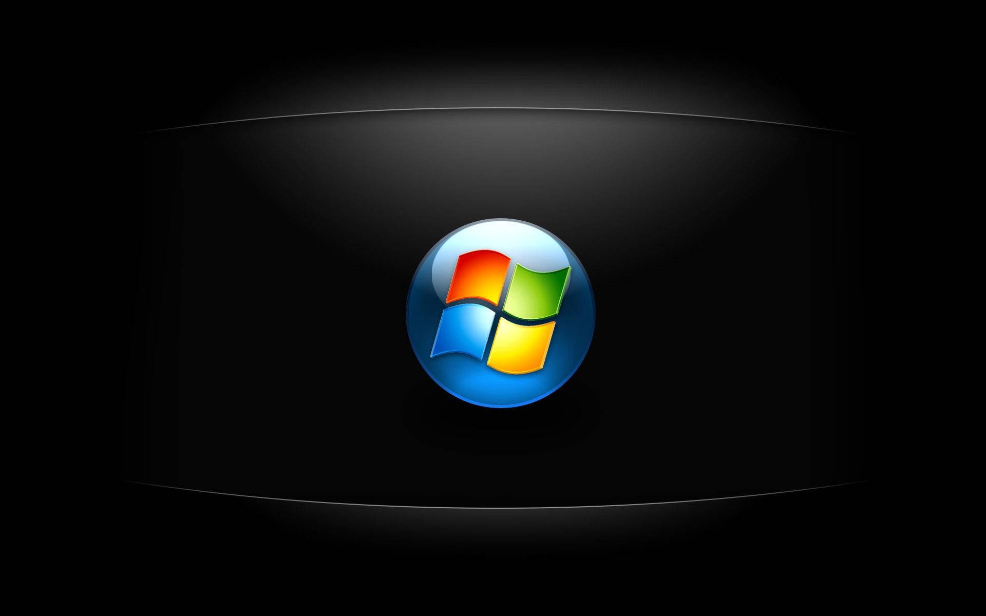 深色 Windows Vista 標誌 壁紙 — 一個光滑的Windows標誌在深色彎曲屏幕背景上發出鮮豔色彩的光芒。