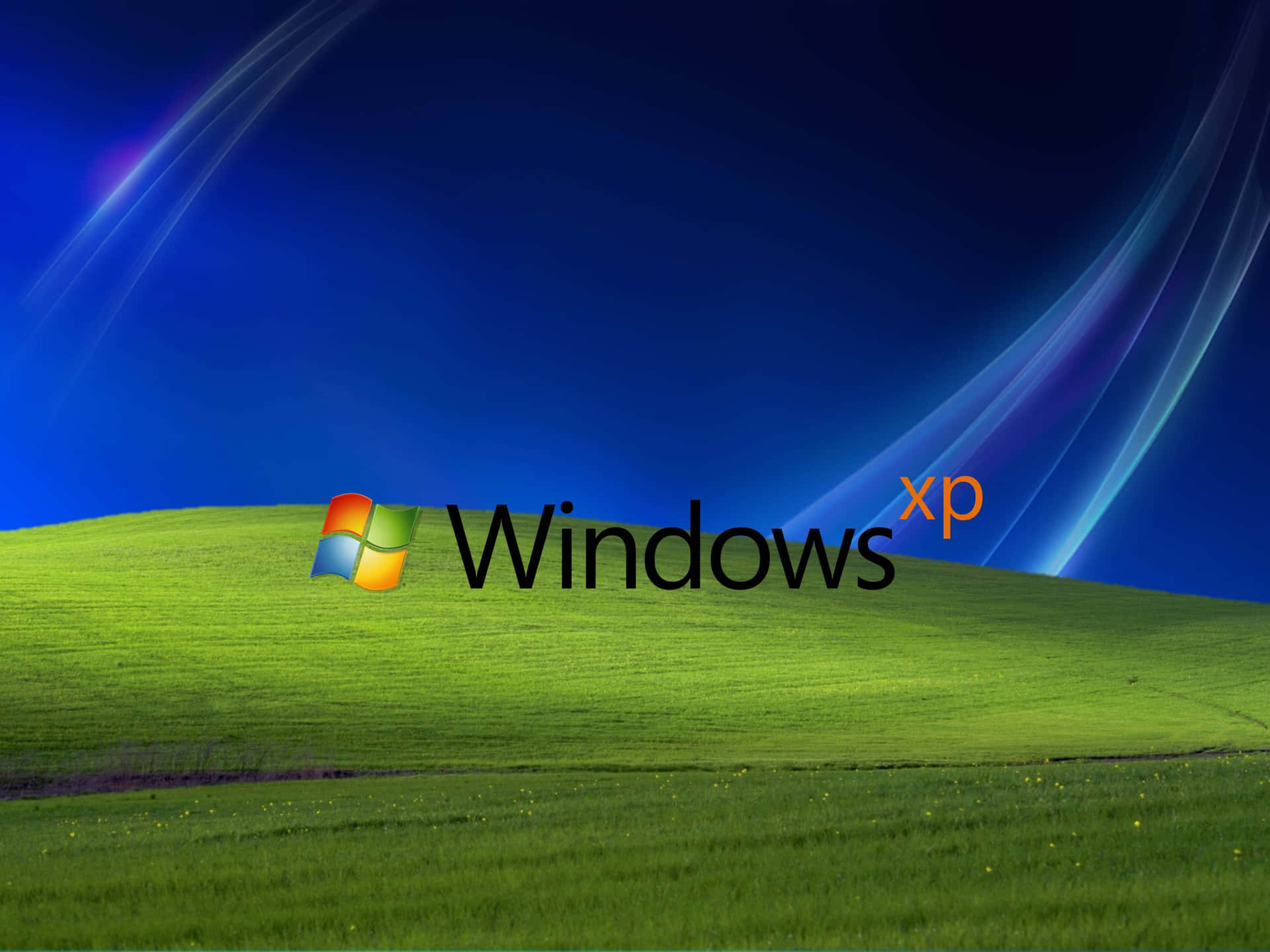 Windows XP標誌在綠色山丘上，配以藍天和光線條紋