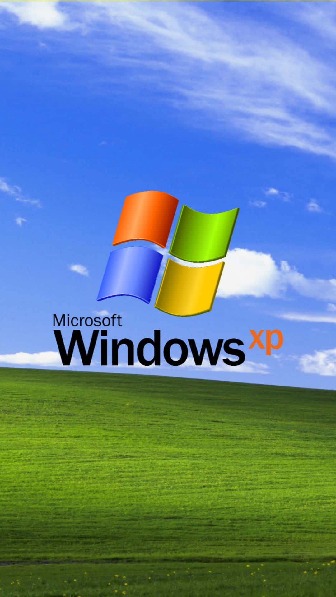 Windows XP 標誌在藍天下的一片綠色田野上