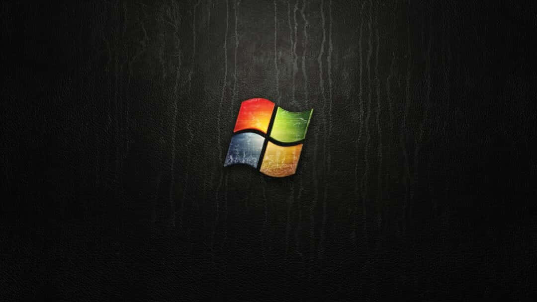 深色紋理背景上帶有彩虹色彩的Windows標誌