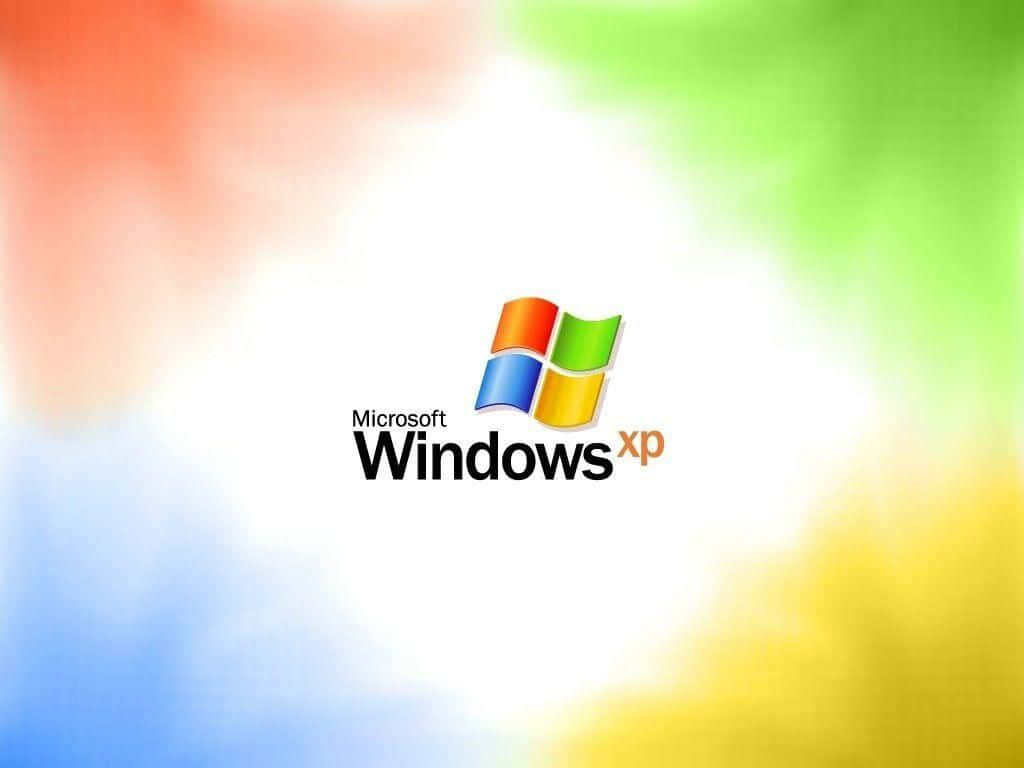 Windows XP 標誌在色彩繽紛的漸變背景上。