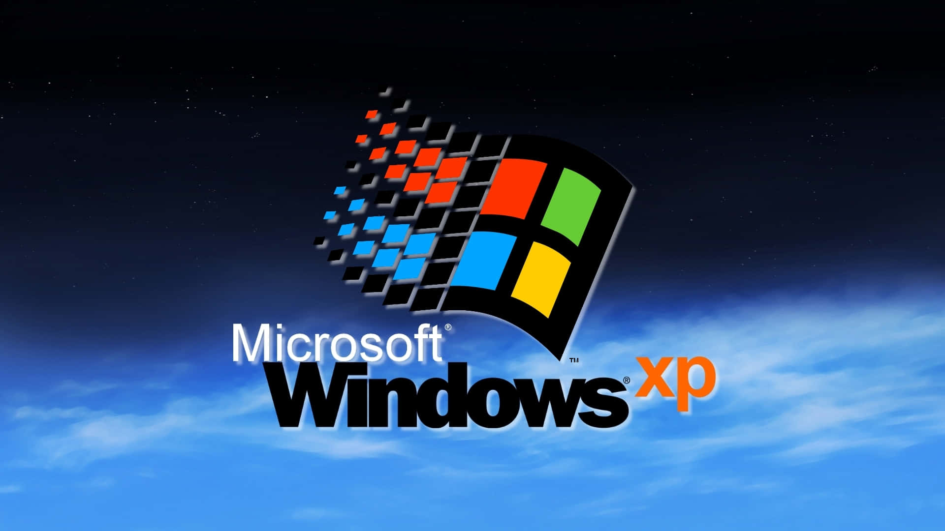 Windows XP標誌在星空和雲朵的夜空背景下