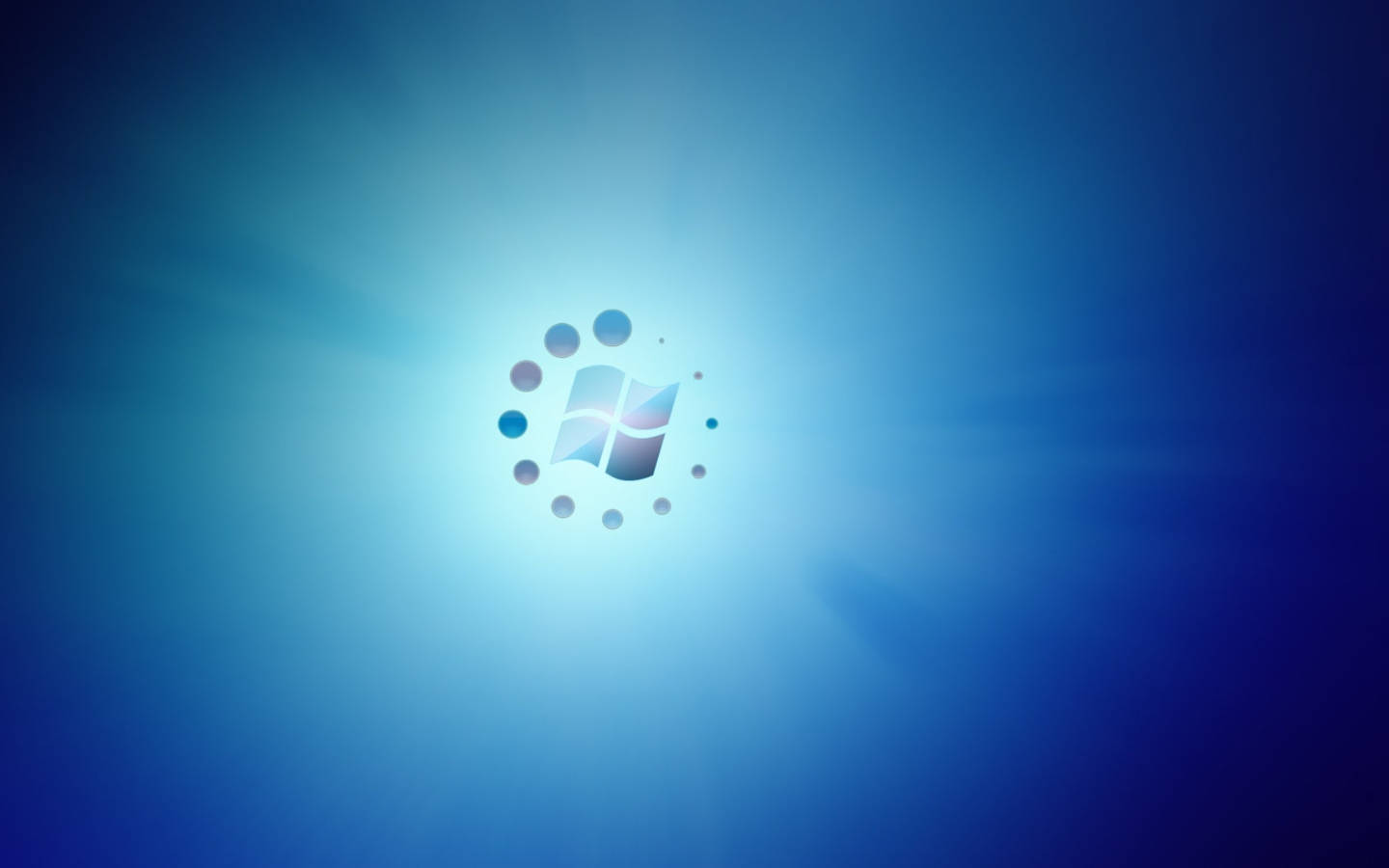 藍色 桌布 壁紙 — Windows 標誌在散發光芒的藍色漸變背景中央柔和發光，光線向外放射。