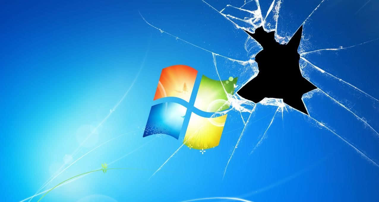 碎玻璃效果，帶有 Windows 標誌和從黑洞向外輻射的裂紋，背景為藍色。
