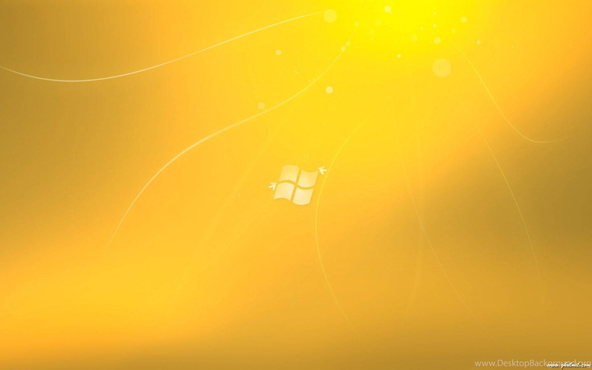 Windows標誌在帶有光條的金色抽象背景上。