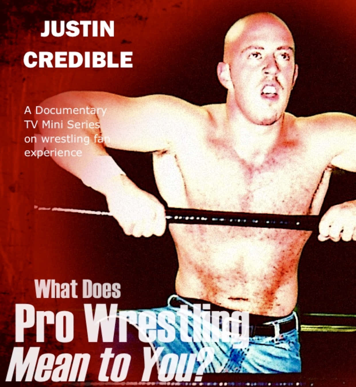 WWE超級巨星賈斯汀·克瑞迪爾打破紀錄——摔角雜誌封面 壁紙 — 一個光頭男人穿著牛仔褲，在紅色紋理背景上以強烈表情對抗摔角腰帶。