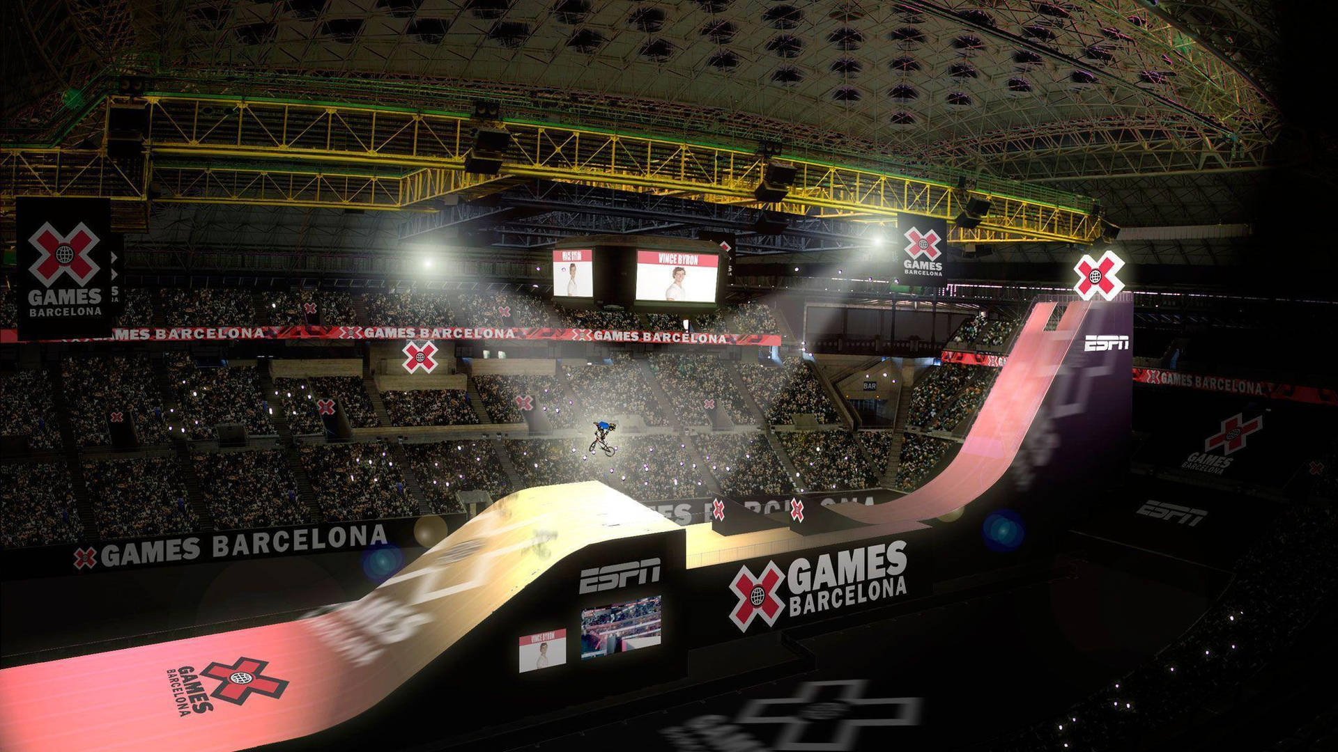 滑雪板運動員在燈光明亮的室內場館中於巴塞隆拿X Games凌空飛躍。