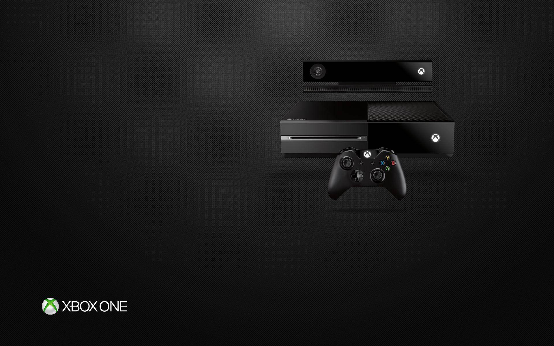 深色紋理背景上的Xbox One主機和控制器