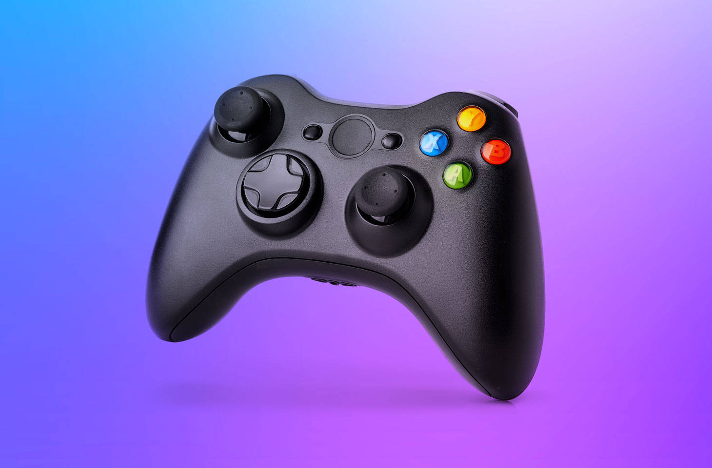 黑色Xbox手掣在漸變藍紫背景上