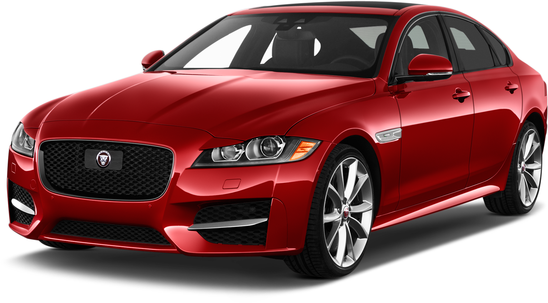 紅色捷豹 XE 車型側面視圖 壁紙 — 一輛光澤的紅色積架轎車在攝影棚燈光下，在純黑背景上閃耀，展現其流線型空氣動力學設計和拋光合金輪圈。