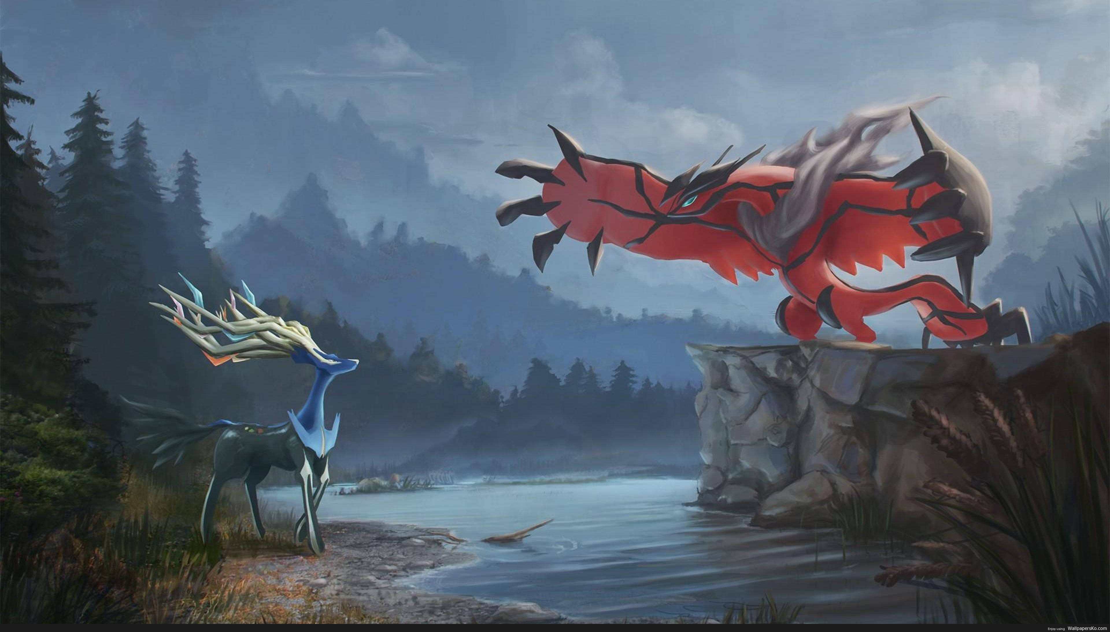 Xerneas對戰Yveltal 寵物小精靈 4K 壁紙 — 一隻雄偉的藍色鹿狀生物面對著一隻棲息在懸崖上的高聳紅色巨龍，俯瞰著霧氣瀰漫的森林湖泊。