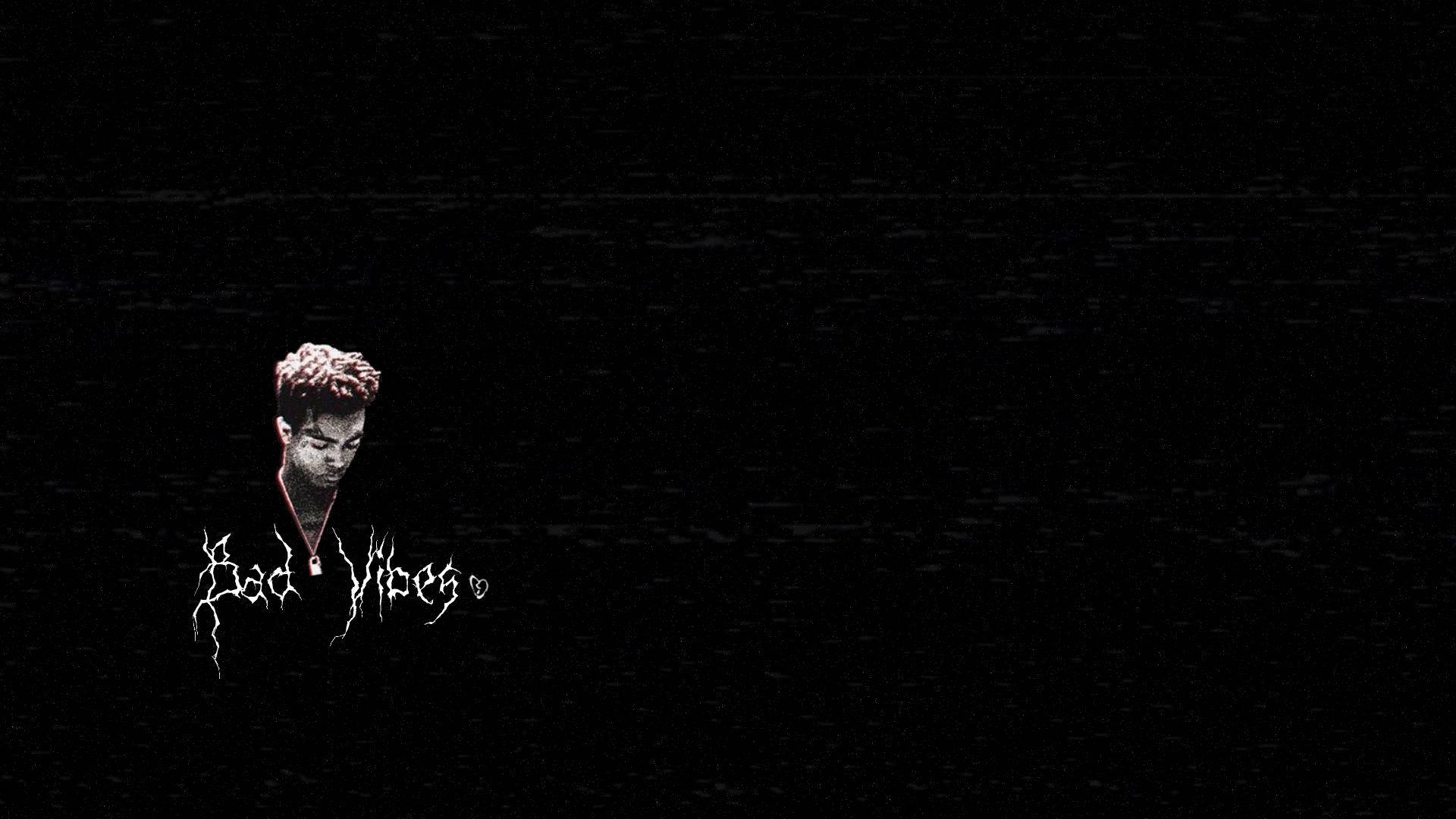 一個故障風格的人物，背景為黑色靜態，帶有「Bad Vibes」文字。