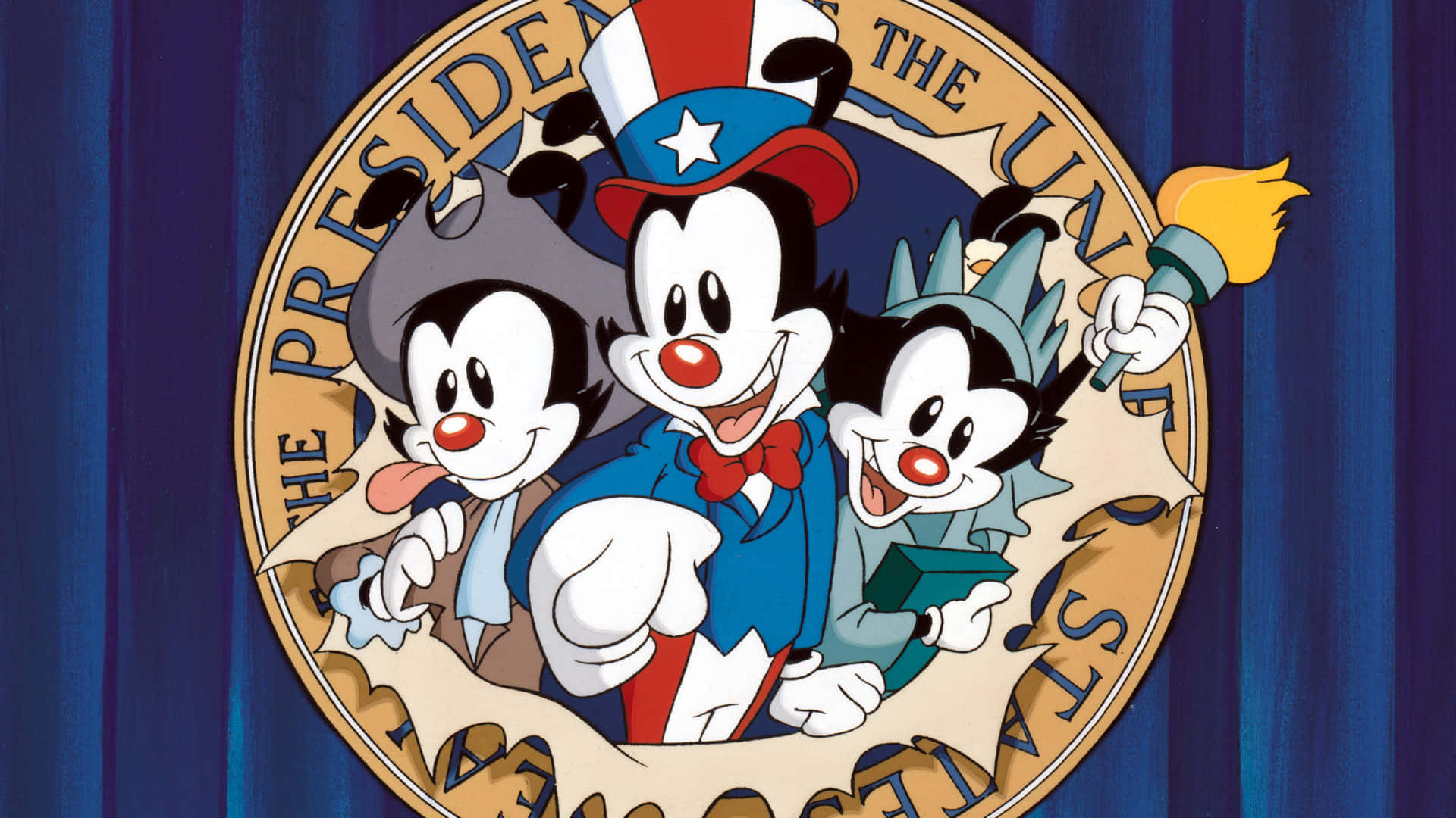 Yakko、Wakko 與 Dot —— Animaniacs 的明星 壁紙 — 三個卡通角色穿著愛國服裝，在藍色窗簾背景下的圓形印章內愉快地擺姿勢。