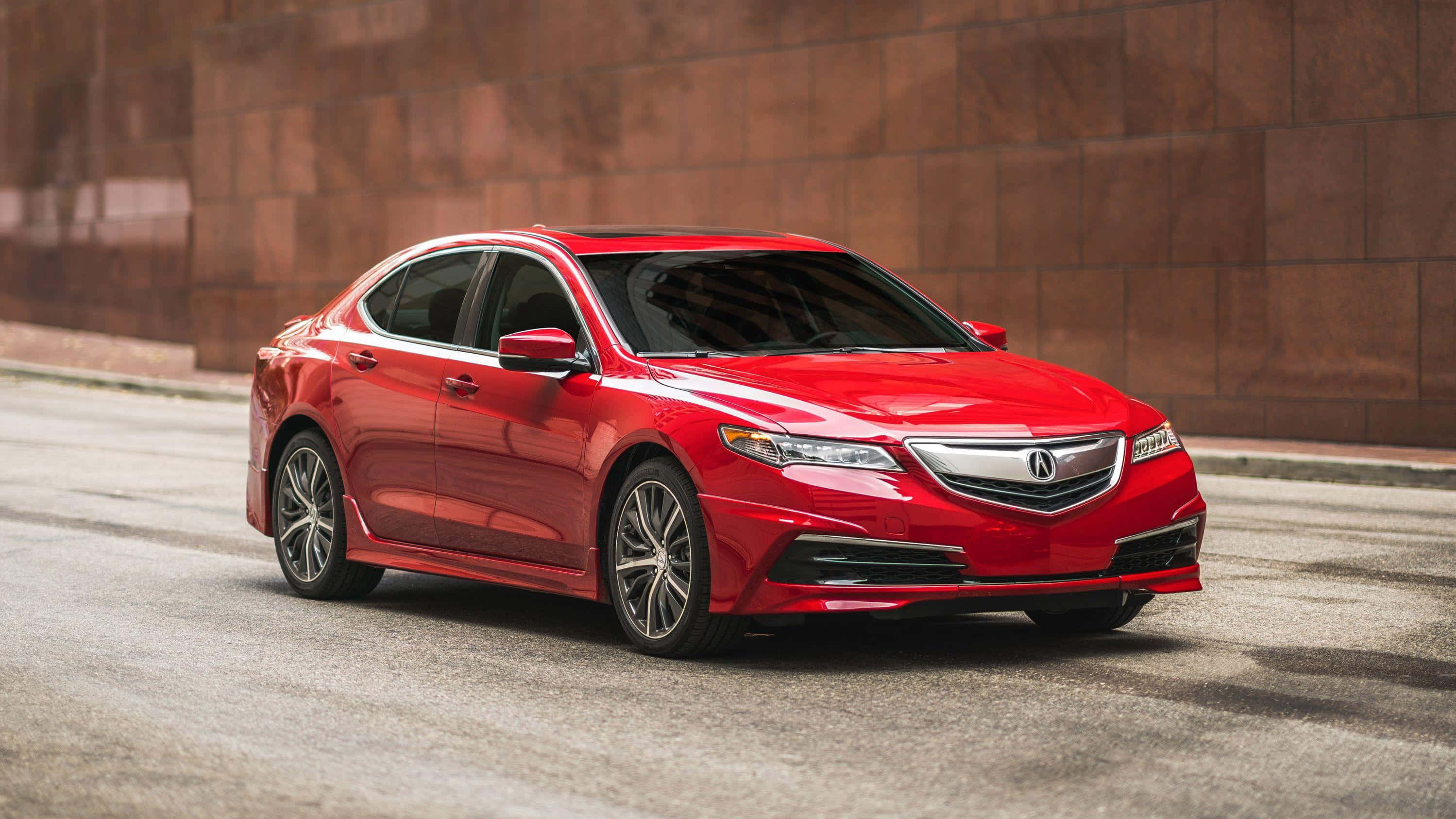 Acura Tlx 桌布 壁紙 — 一輛光澤的紅色Acura轎車停泊在城市的街道上，旁邊是帶紋理的棕色磚牆。