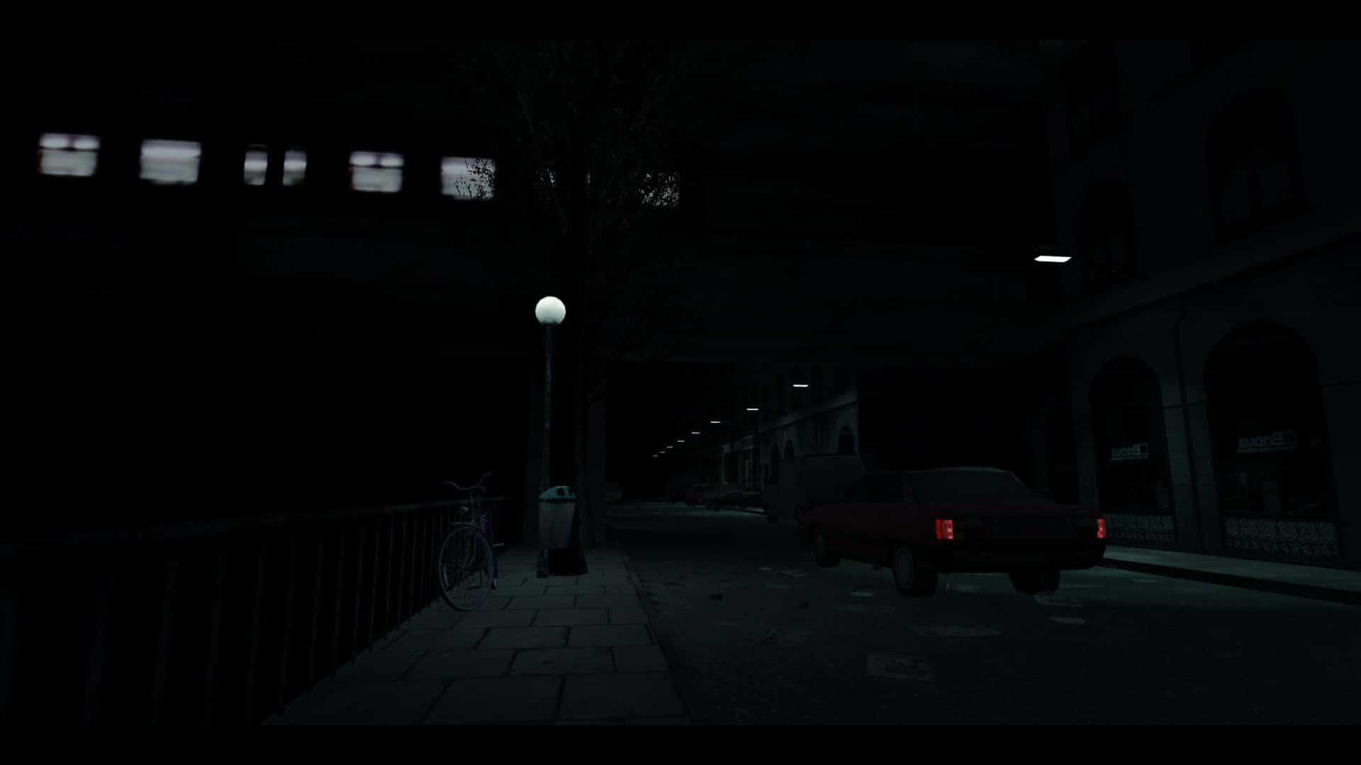  壁紙 — 夜晚一條燈光昏暗的市區街道，停著一輛紅色汽車，孤獨的路燈將微弱的光線投射在有人行道上的一輛單車上。