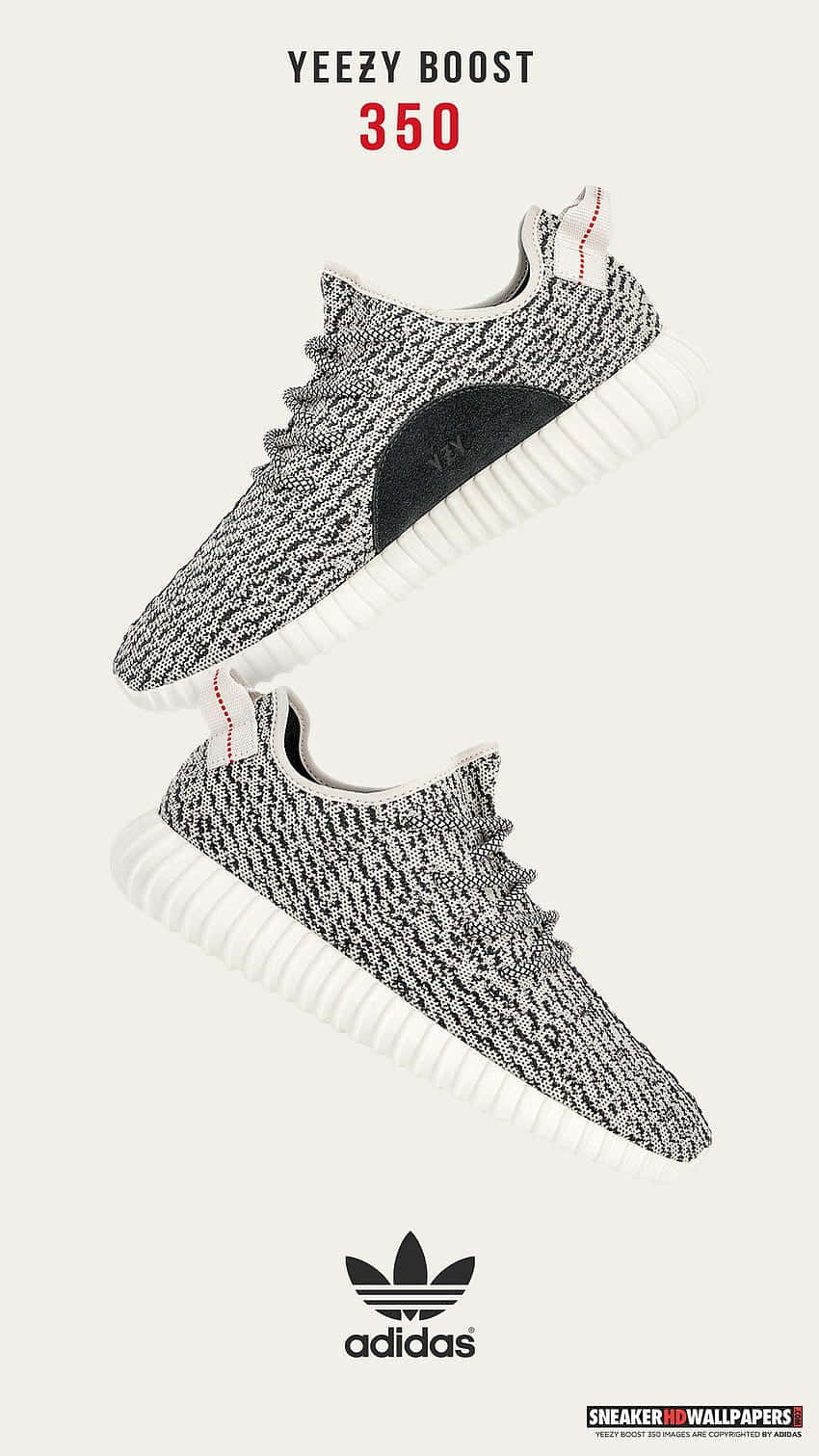 灰色針織白色鞋底的Yeezy Boost 350運動鞋漂浮在米白色背景上。