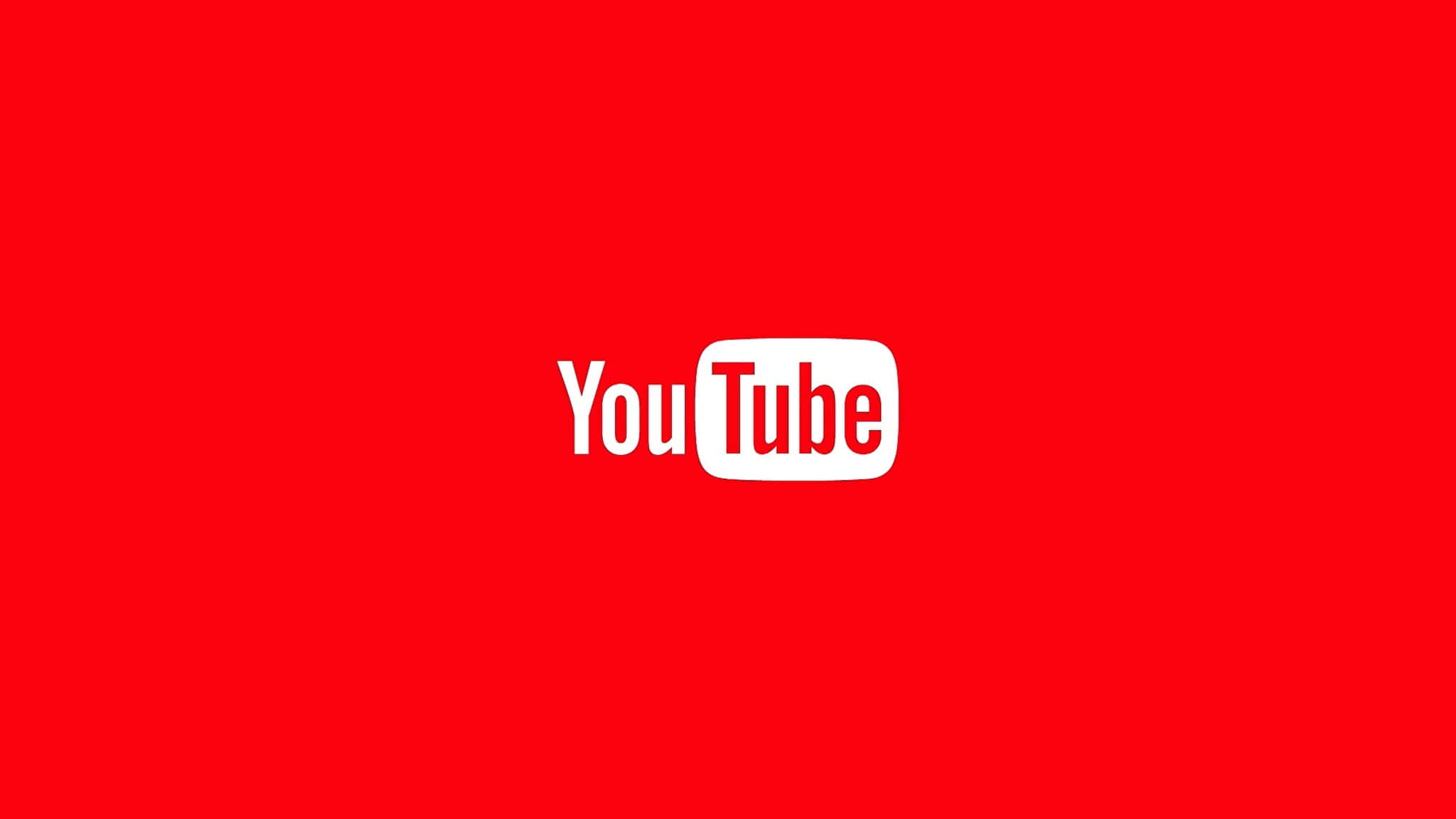 Video Marketing 桌布 壁紙 — 一個大膽的白色YouTube標誌居中在純紅色背景上。