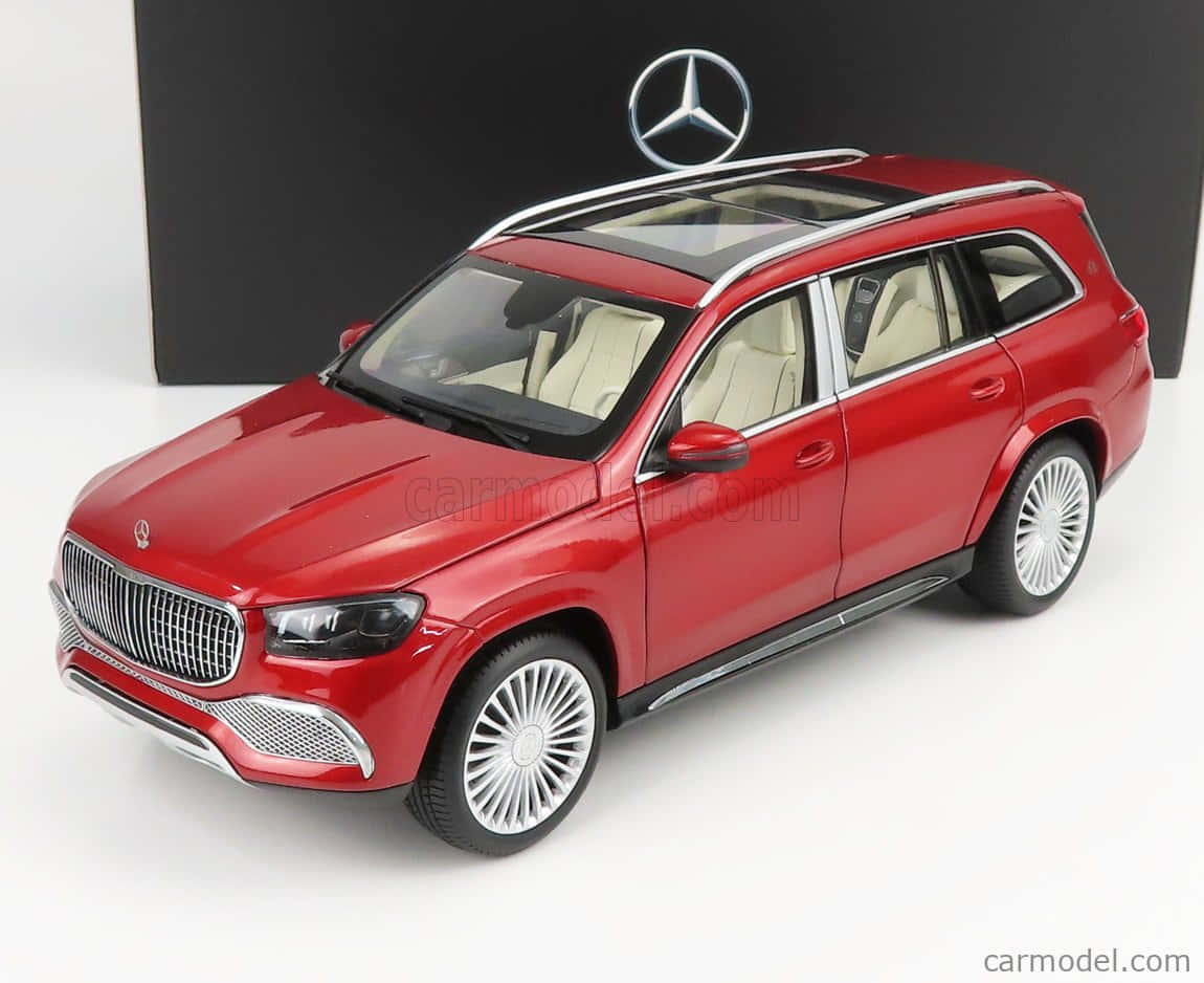 Maybach Gls 600 桌布 壁紙 — 一個光澤的紅色Mercedes-Benz GLS SUV模型，配備銀色車頂行李架和白色內飾，在黑色背景上展示。