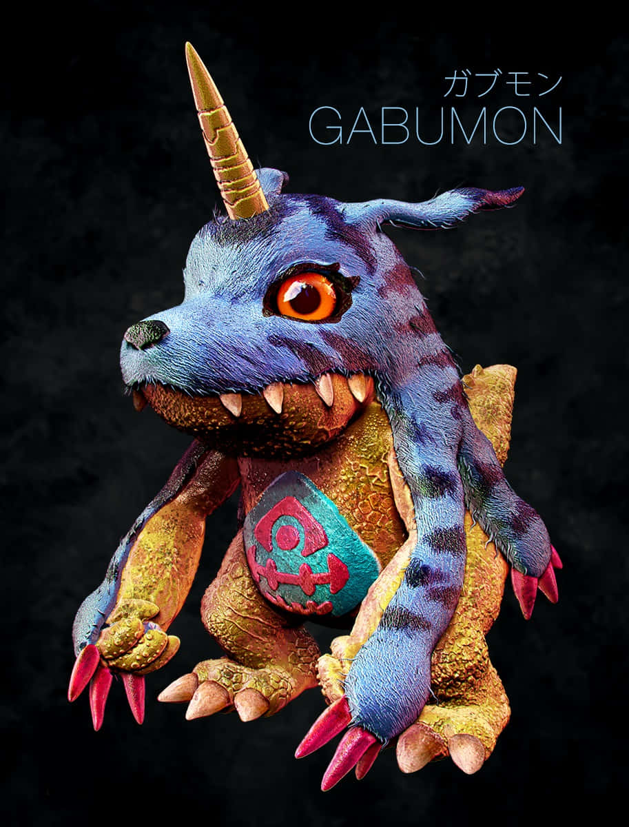Gabumon 桌布 壁紙 — 一個詳細的3D渲染數碼暴龍加布獸，擁有藍色毛皮、金色角和橙色眼睛，背景為深色。