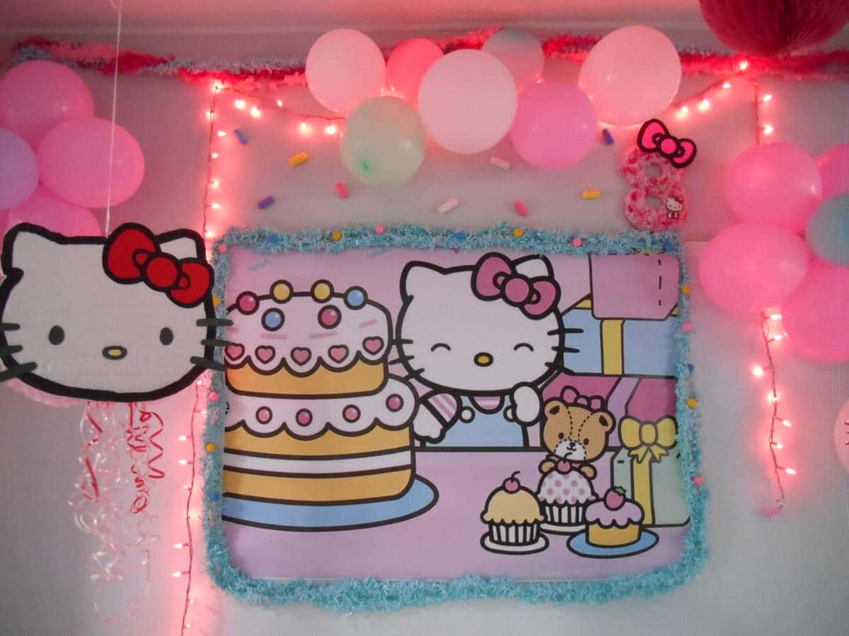 Hello Kitty Party 桌布 壁紙 — 以Hello Kitty氣球、燈串和大型卡通蛋糕海報裝飾的粉紅色主題生日牆。
