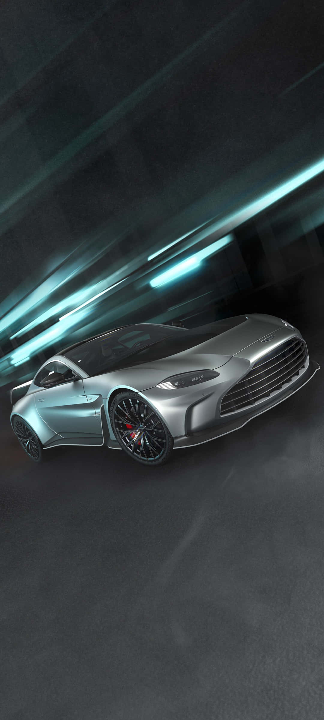 Aston Martin Vantage 桌布 壁紙 — 一輛時尚的銀色跑車在黑暗的隧道中滑行，隧道被條紋狀的青綠色燈光照亮。