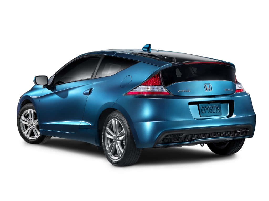 Honda Cr-z 桌布 壁紙 — 一輛時尚金屬藍色本田CR-Z運動轎跑車，從後方四分之三角度展示在乾淨的白色背景上。